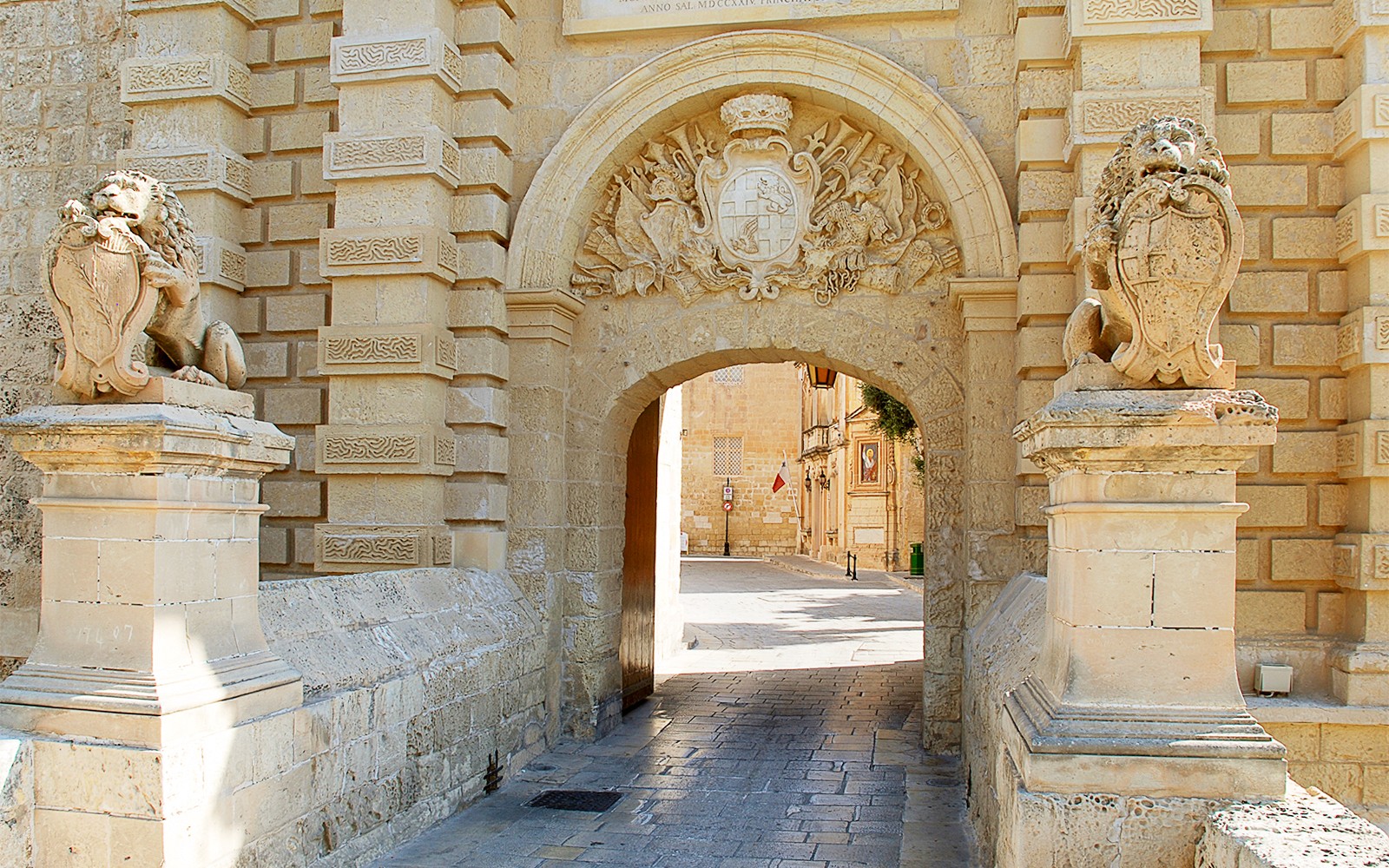 Mdina Gate entrance with stone lions, part of the 2.5-hour guided tour of Mdina and Rabat.