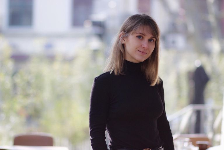 man filming on beach
