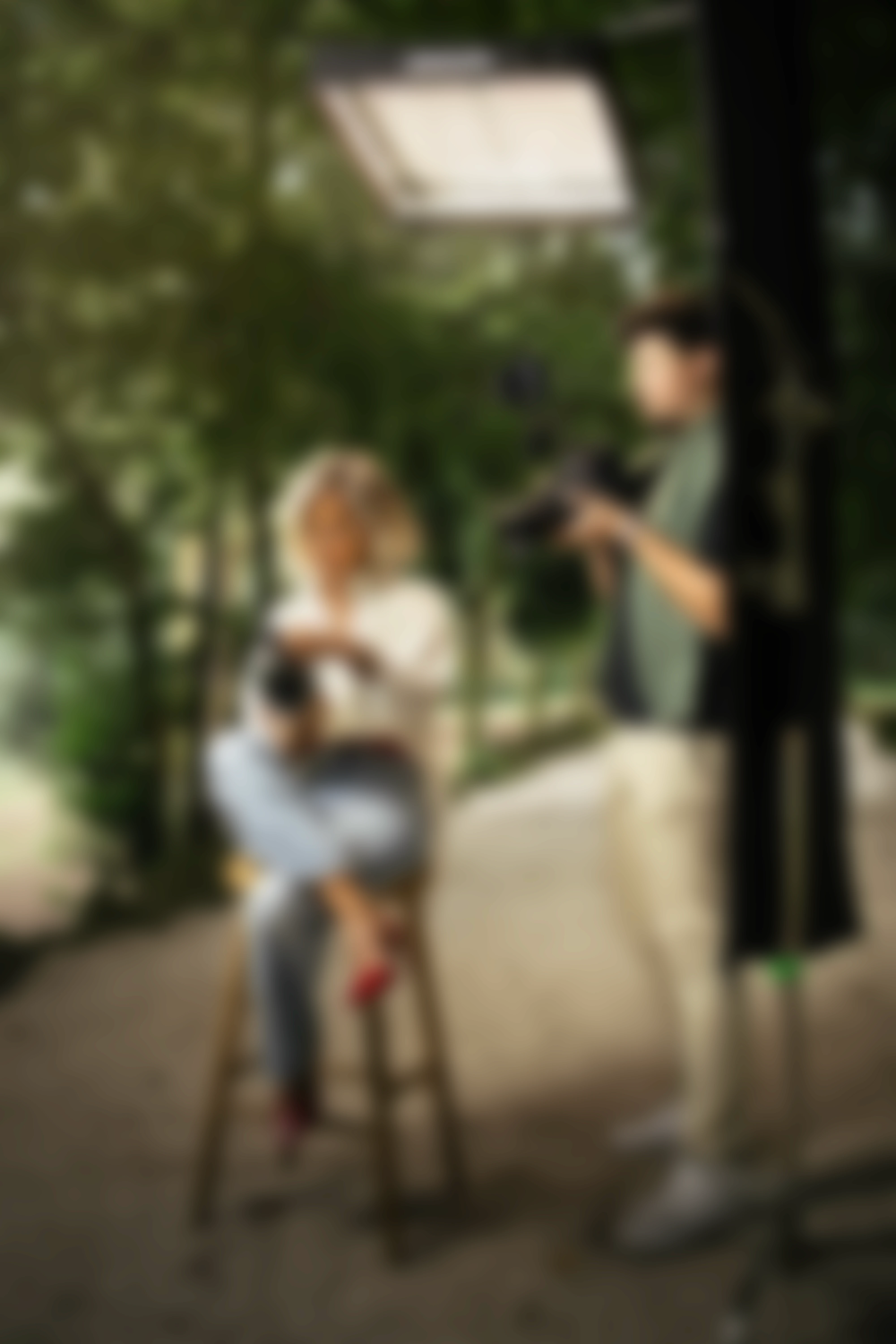 A close-up of white and orange control panels with metallic knobs, slight blur, and circular ports.