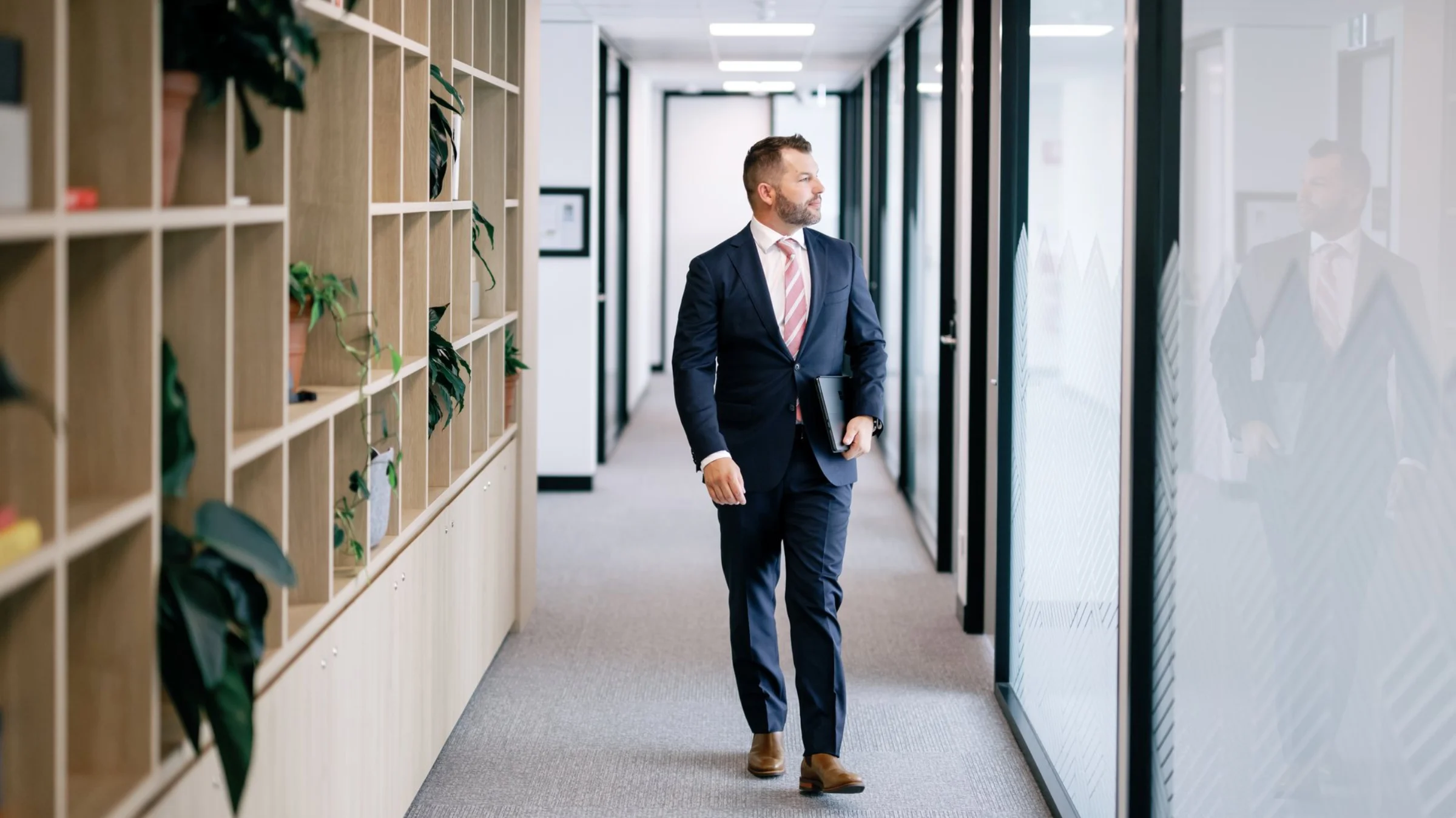 Blake Lieschke walking through the Validated office