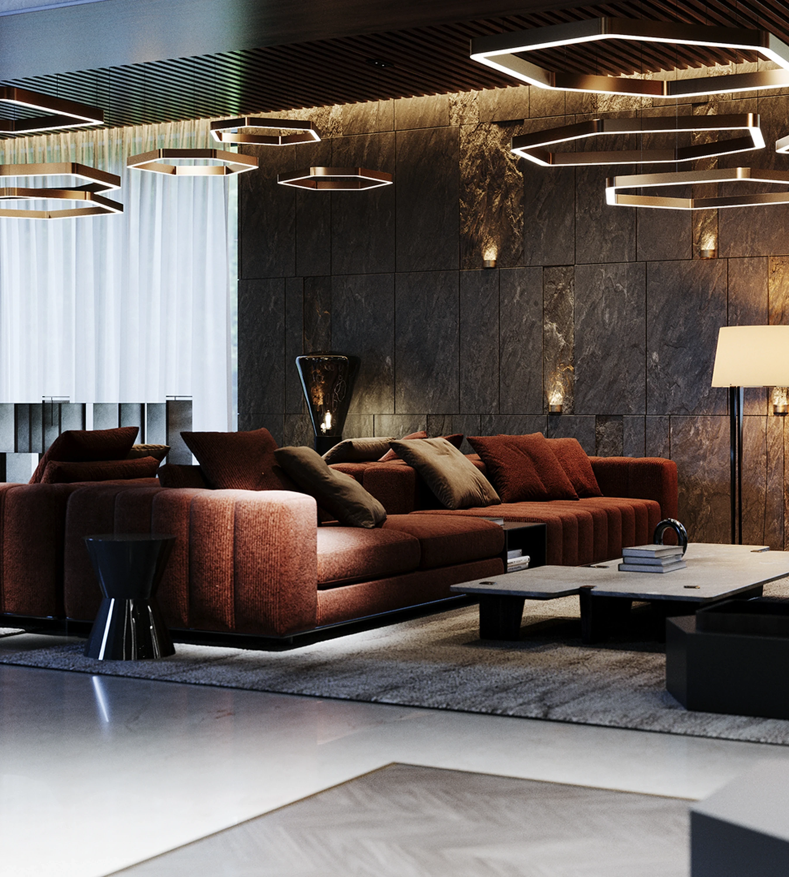 Salon — mur minéral et lumière rasant chaud.