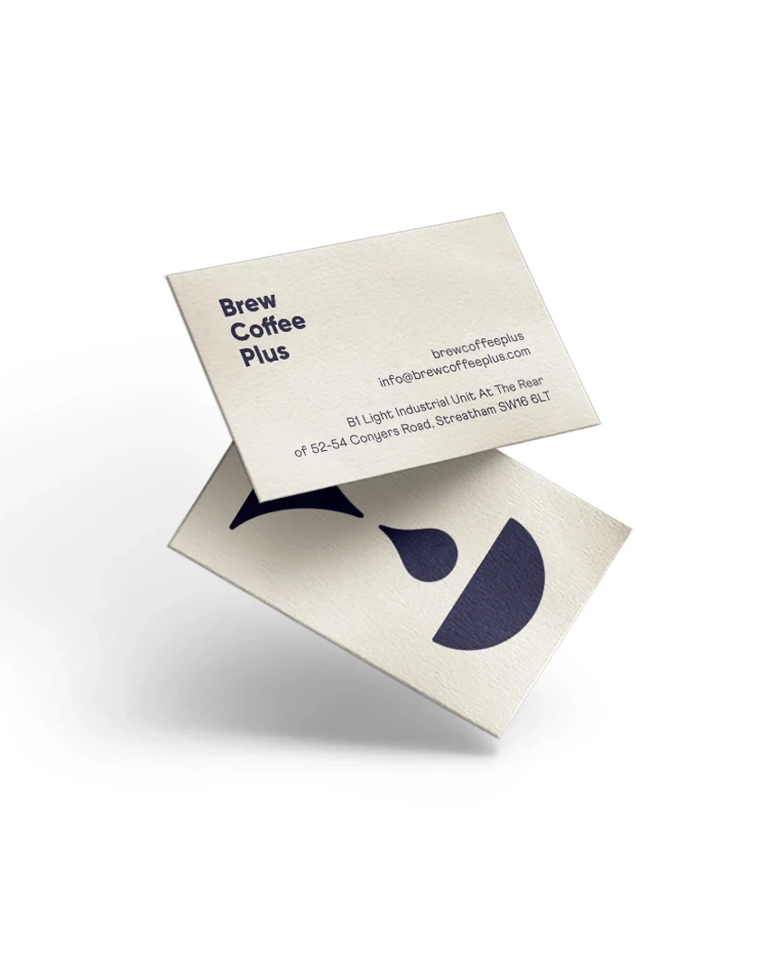 Brew Coffee Plus business cards with logo and contact details on textured paper