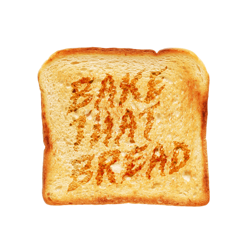 A golden-brown slice of toast with the words "Bake That Bread" burned into the surface.