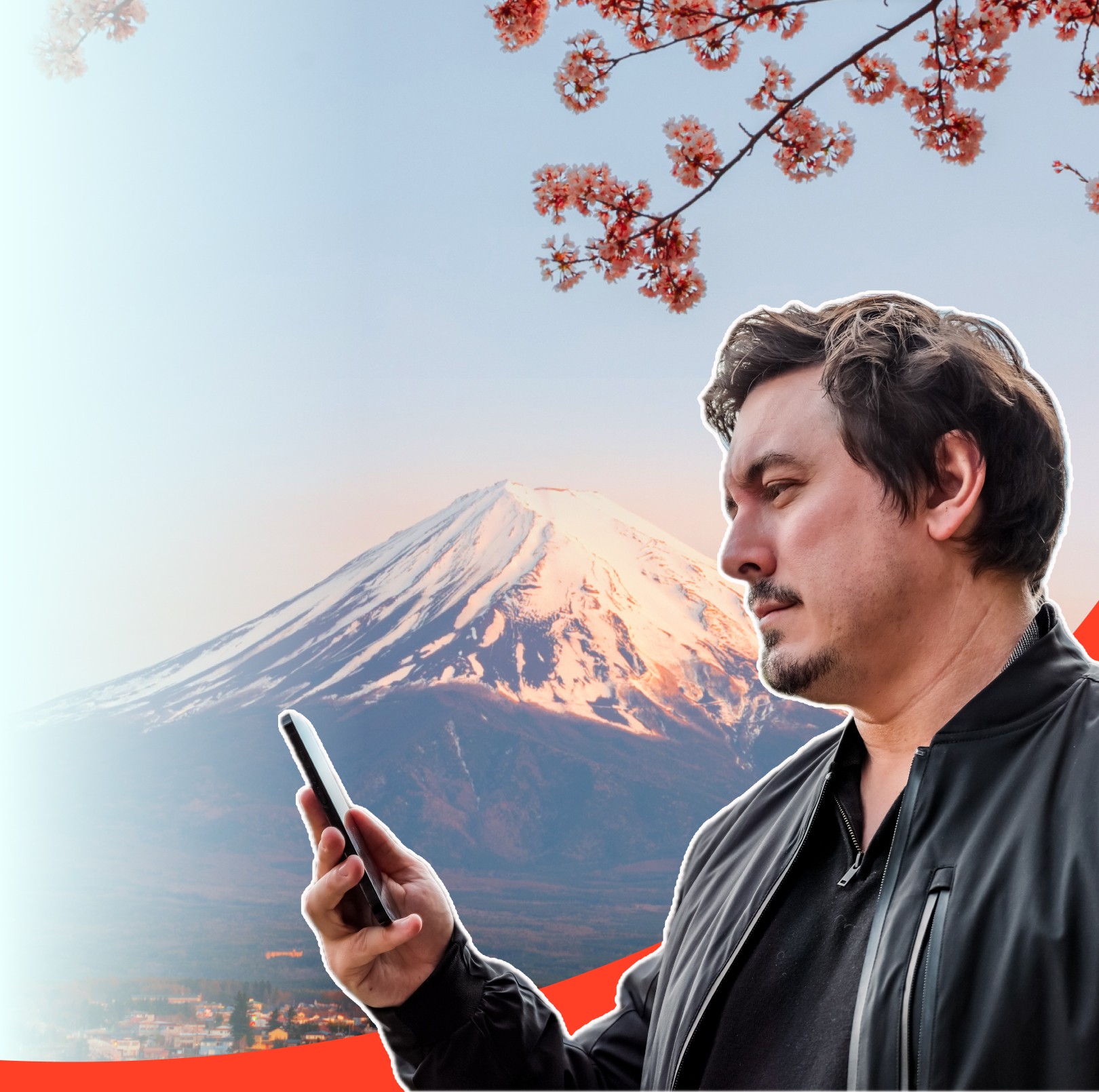 Chris Broad holding a phone with eSIM in front of Mt. Fuji