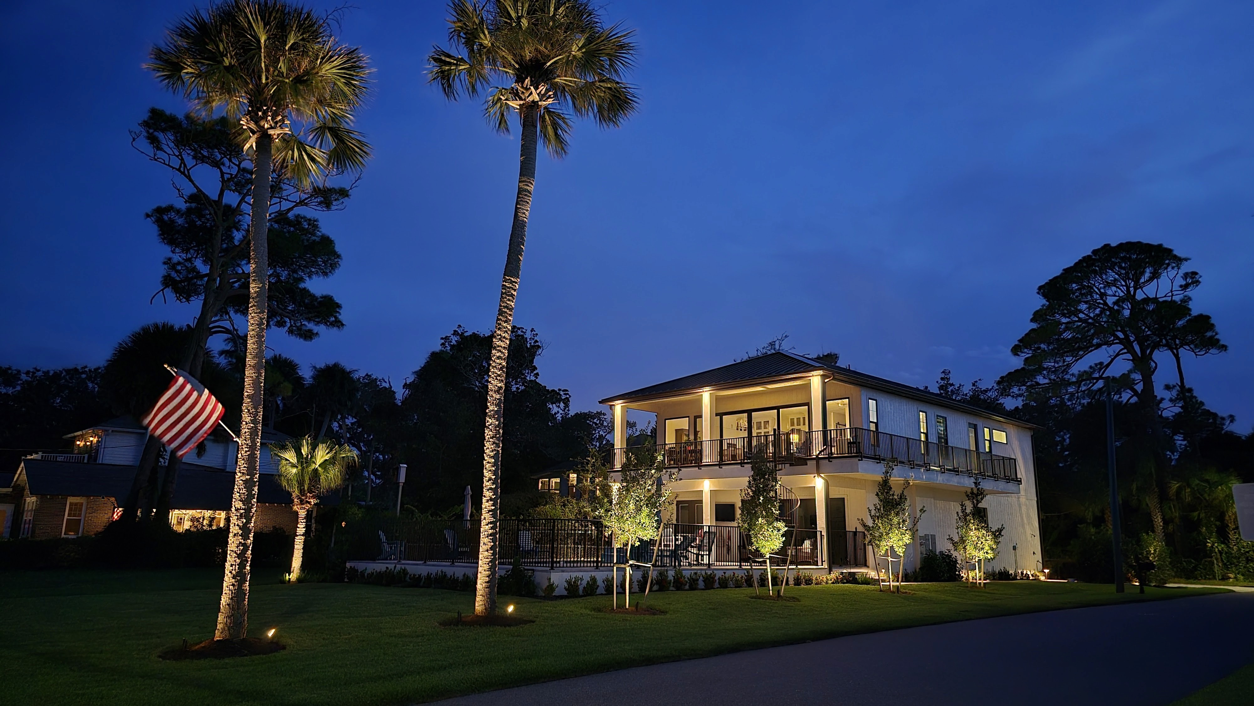 Architectural and landscape lighting installed on a coastal luxury residence