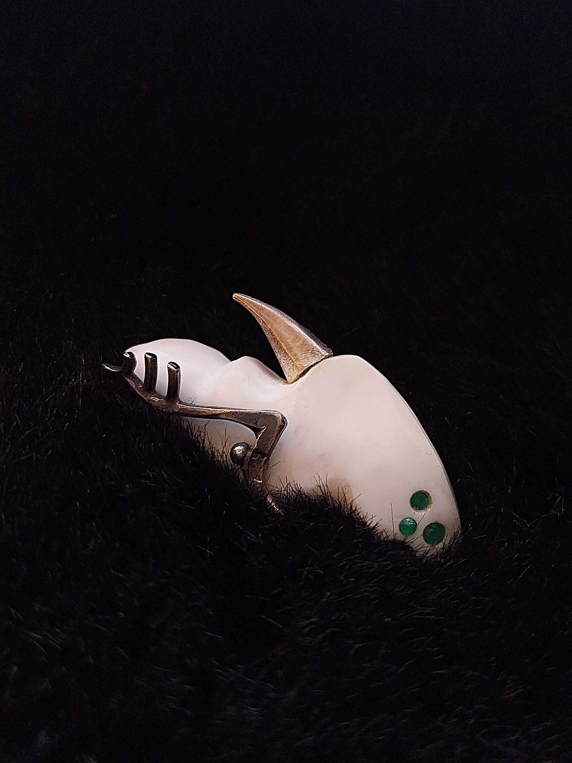 white flea green eyes AK contemporary artjewelry pin on fur amulet natural emerald white composite stone carved