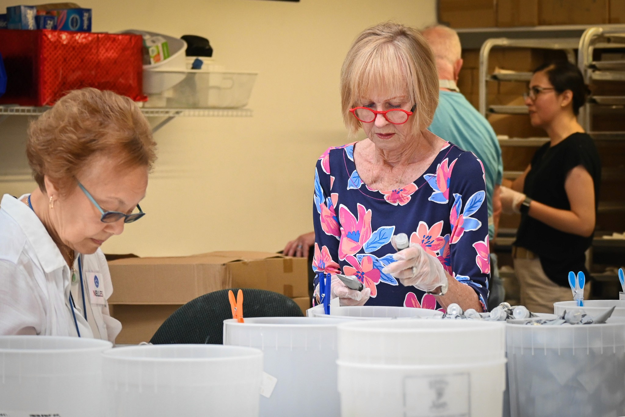 Teenage Volunteers  filling a box