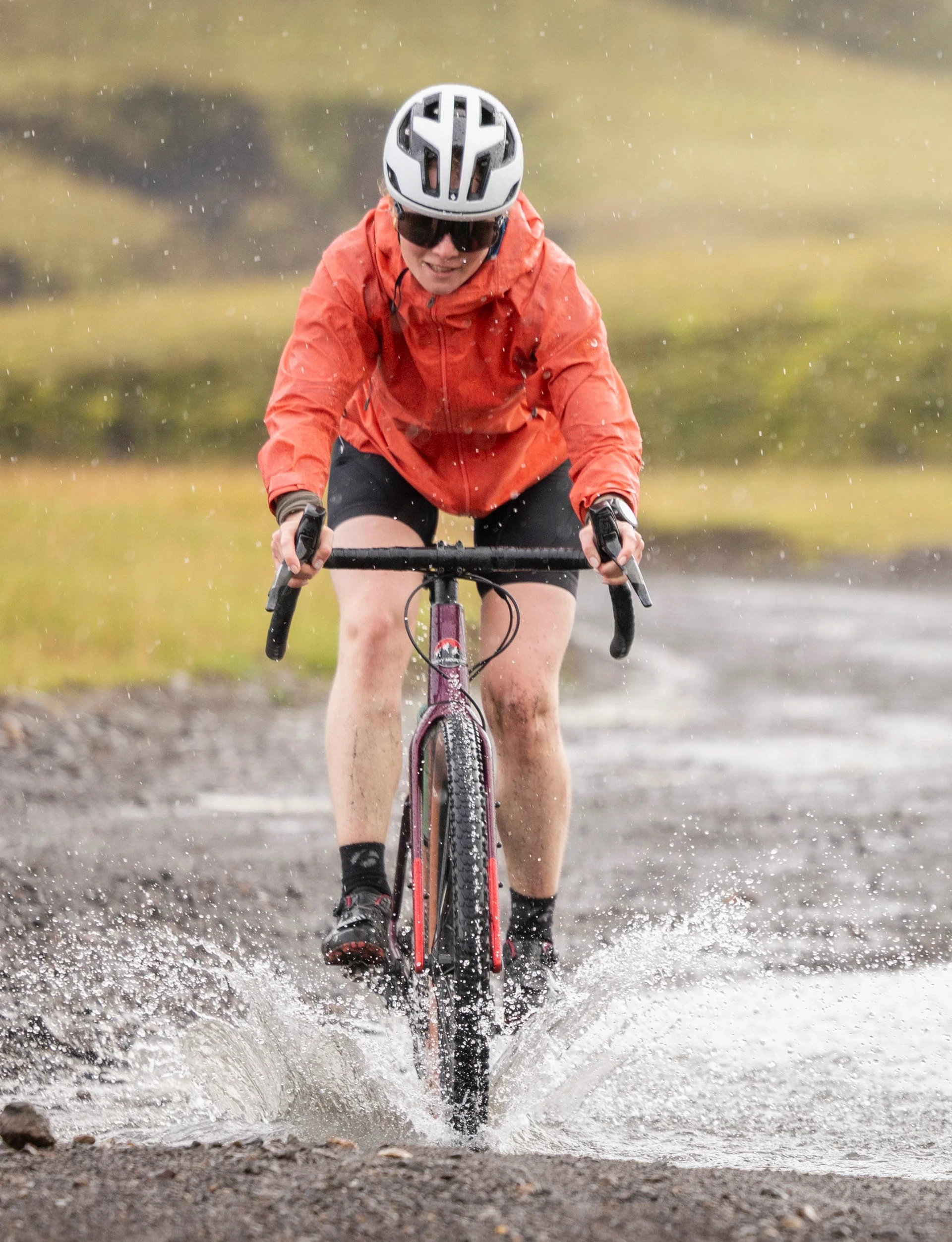 woman biking over river