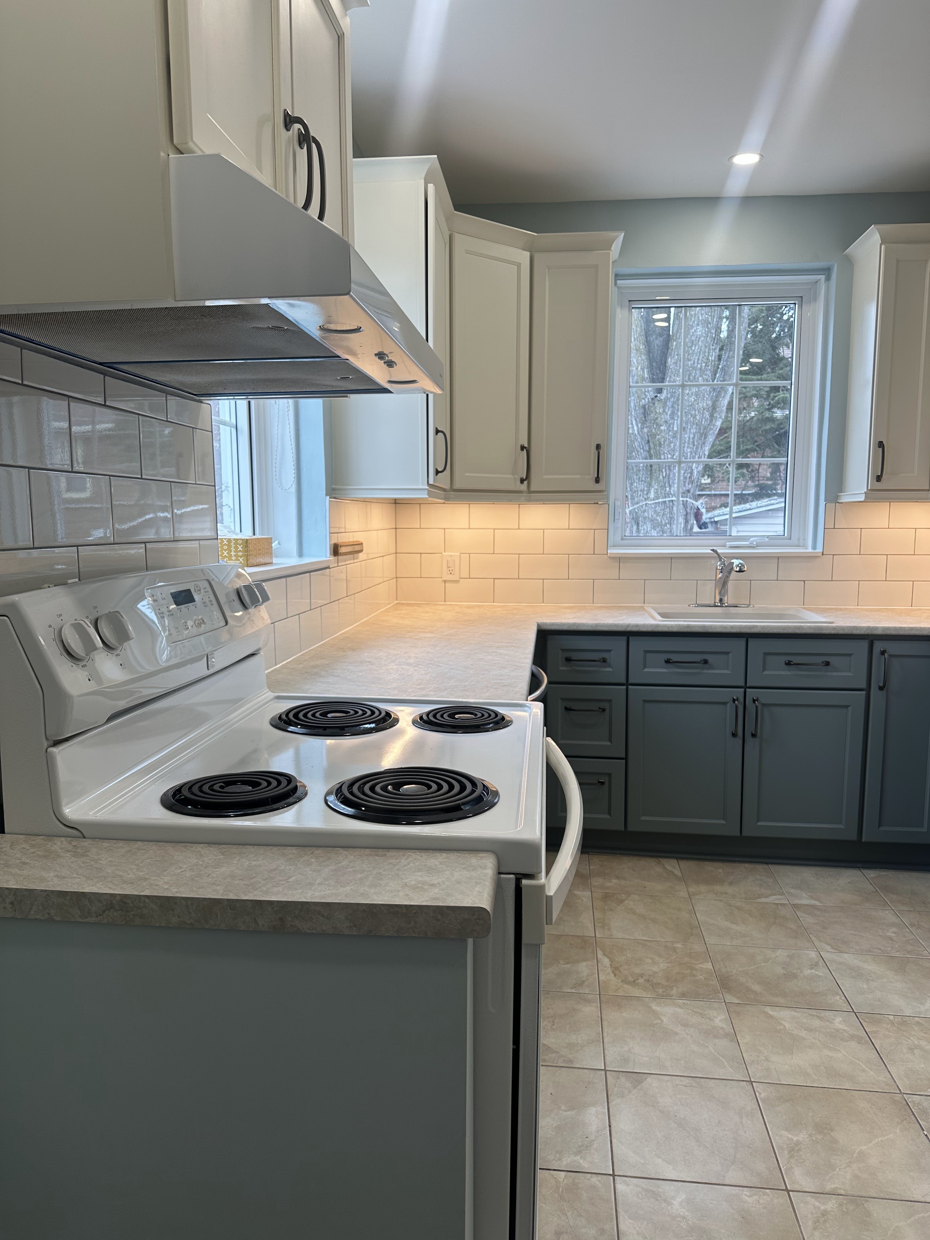 Completed NDG kitchen with new flooring and fresh paint throughout