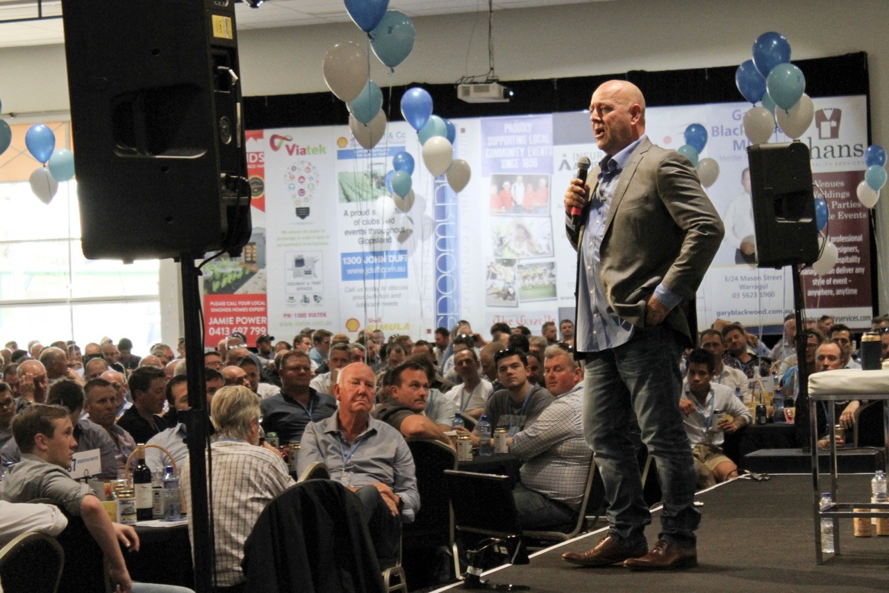 The crowd watching a guest speaker on stage