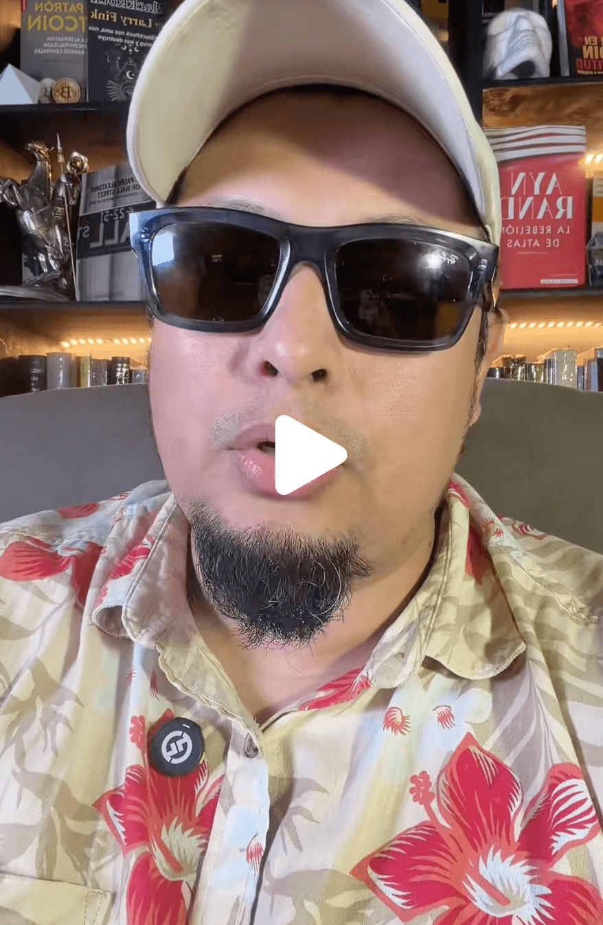 JJ Chagerben wearing sunglasses and a floral shirt, recording a TikTok video from his home office surrounded by books and trophies.