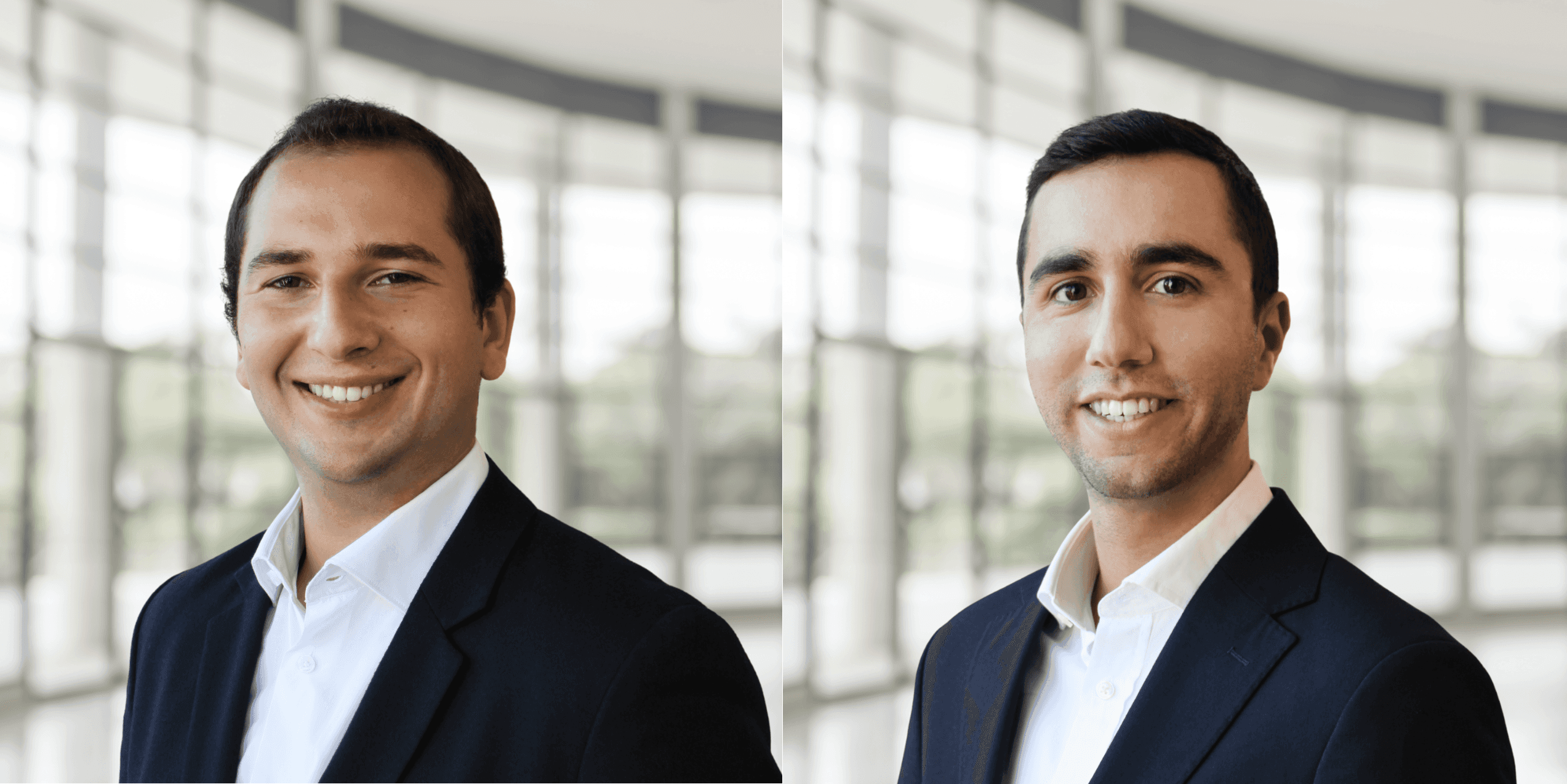 Tall modern skyscraper with vertical lines, viewed against a clear blue sky.