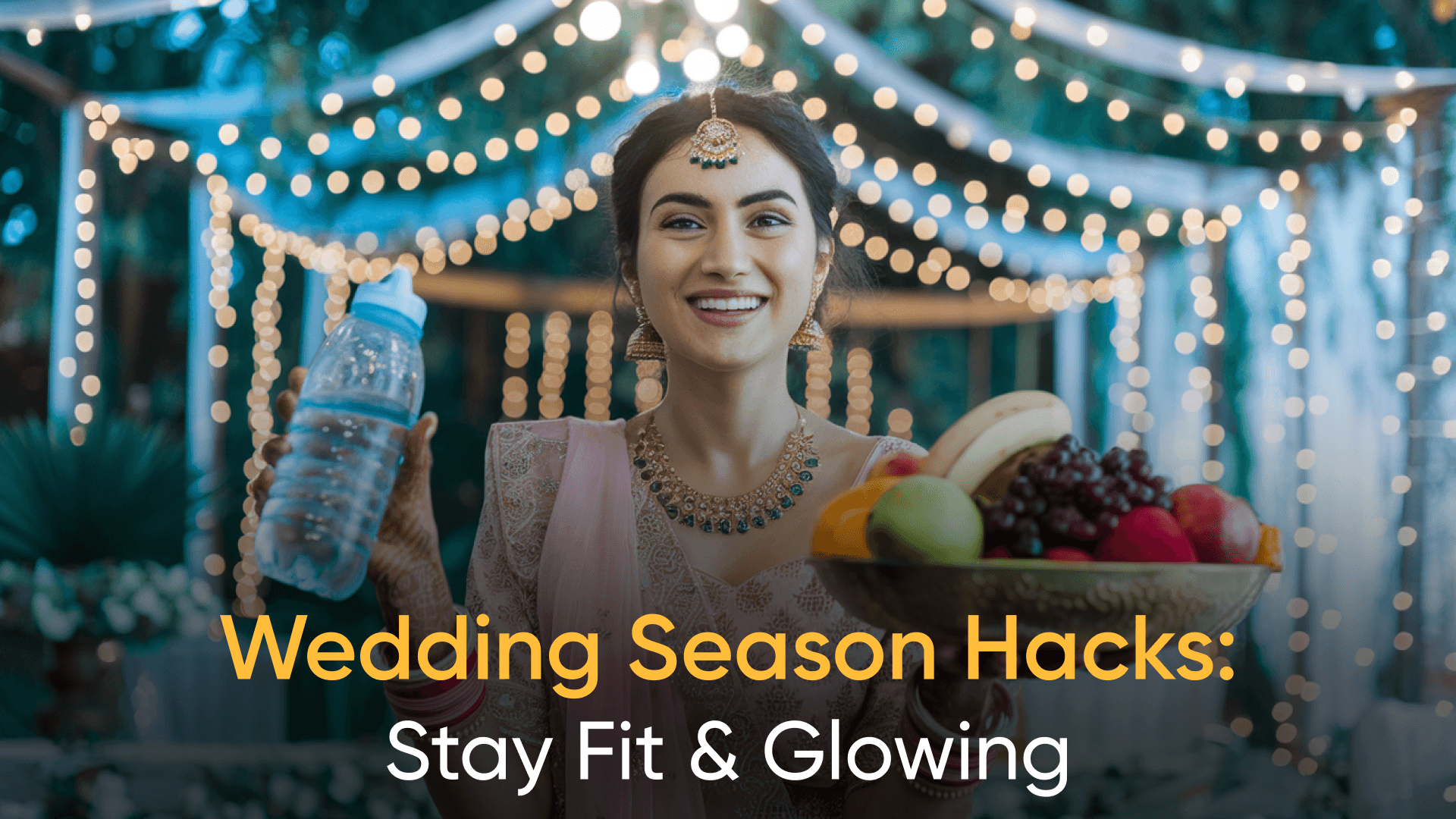 Cheerful Indian woman holding a fruit bowl and water bottle at a wedding, promoting healthy wedding season tips.