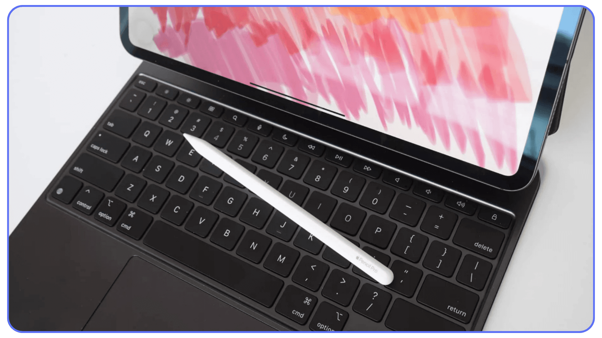 An Apple Pencil resting diagonally on the keyboard of an iPad attached to a Magic Keyboard, with colorful brush strokes displayed on the iPad screen.