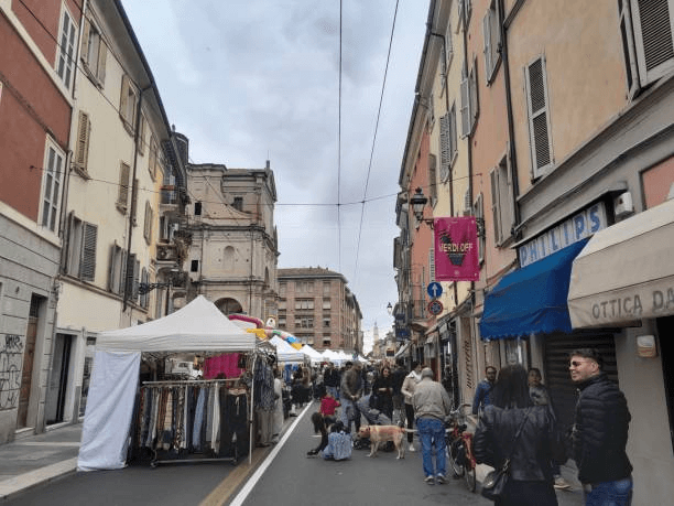 Local daily life in Parma with residents shopping in the city center