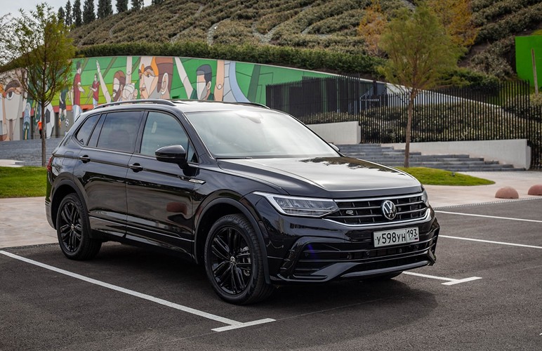 black chevrolet crew cab pickup truck on road during daytime