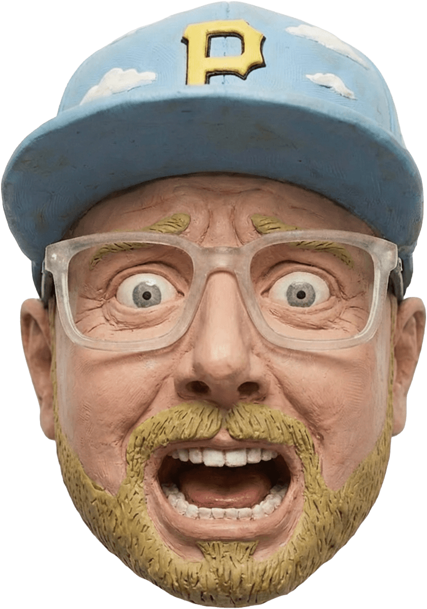 Close-up of a yellow tennis ball sitting on a green court, positioned near the white center line.