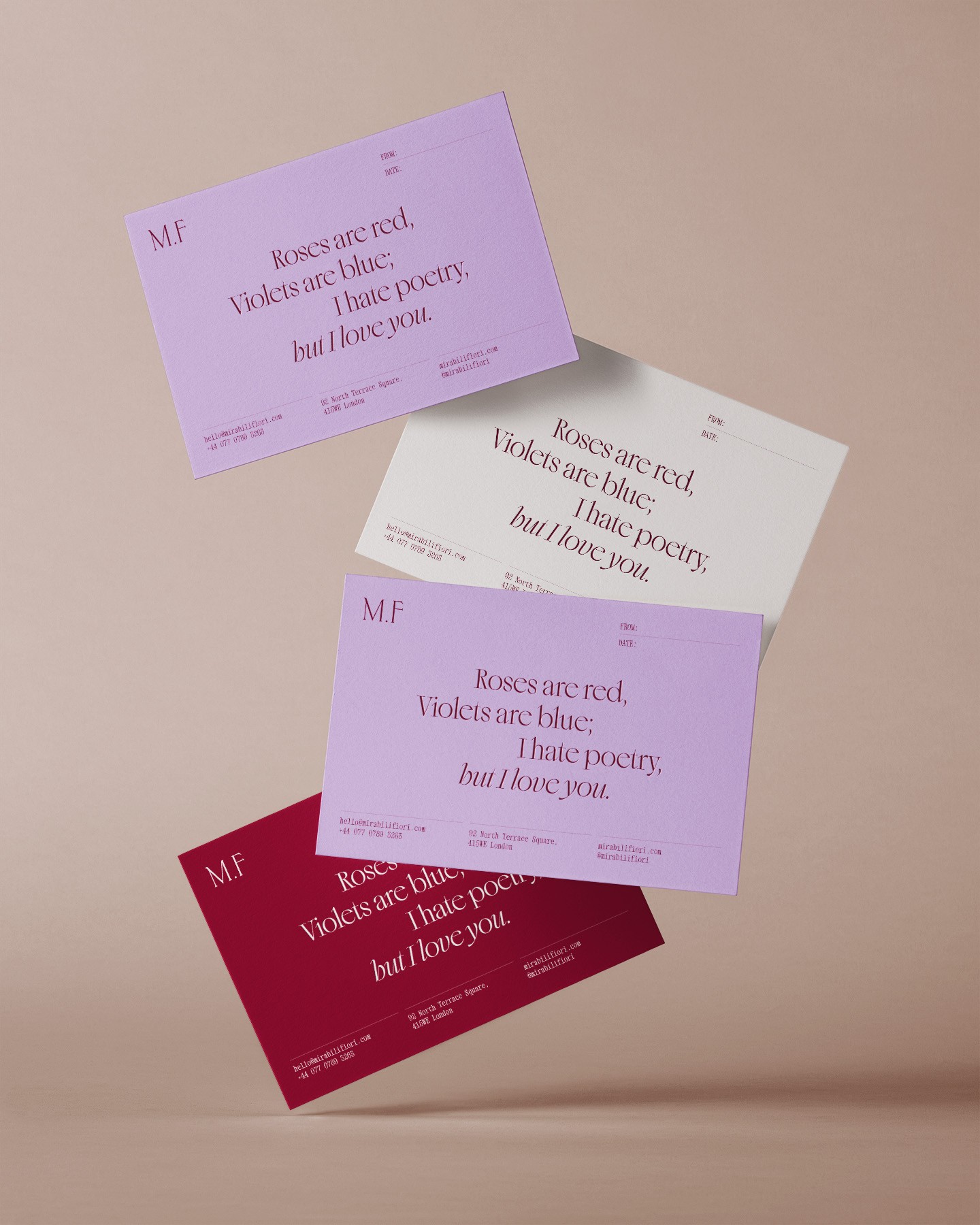 Flying notecards in burgundy, lavender, and cream featuring romantic poetry in elegant serif font