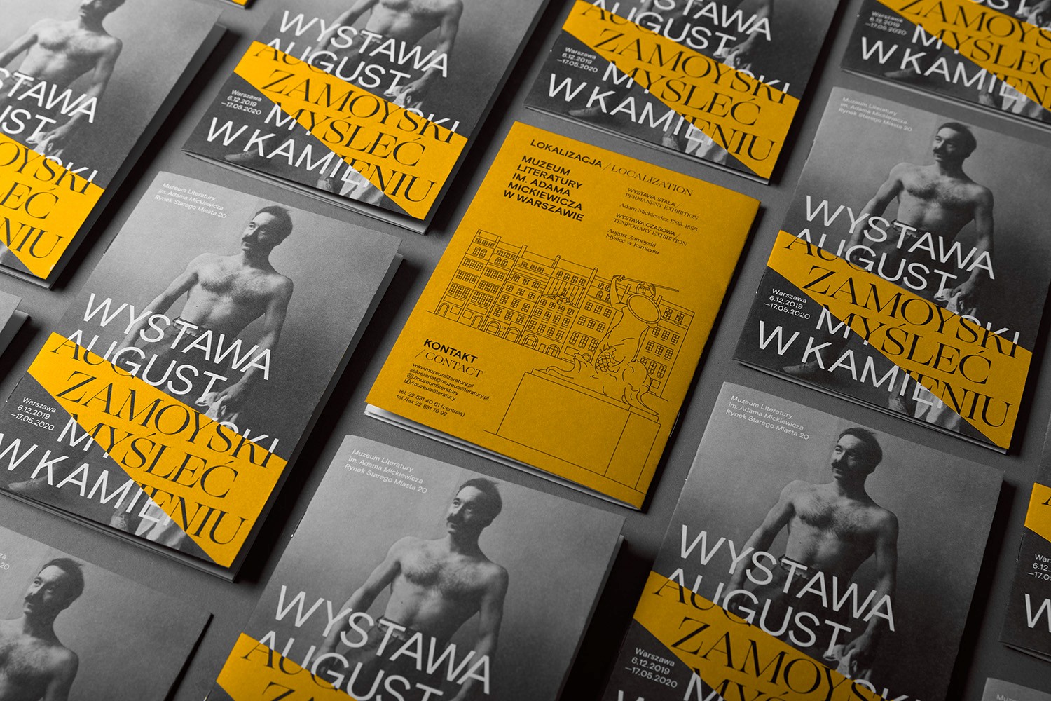 A high-angle grid of exhibition catalogues for the August Zamoyski showcase at the Museum of Literature. The design features high-contrast black-and-white sculptural portraits paired with bold yellow typographic overlays, reflecting the studio's expertise in cultural editorial design and modern institutional branding.