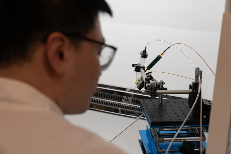 Technician using laboratory equipment for testing and analysis