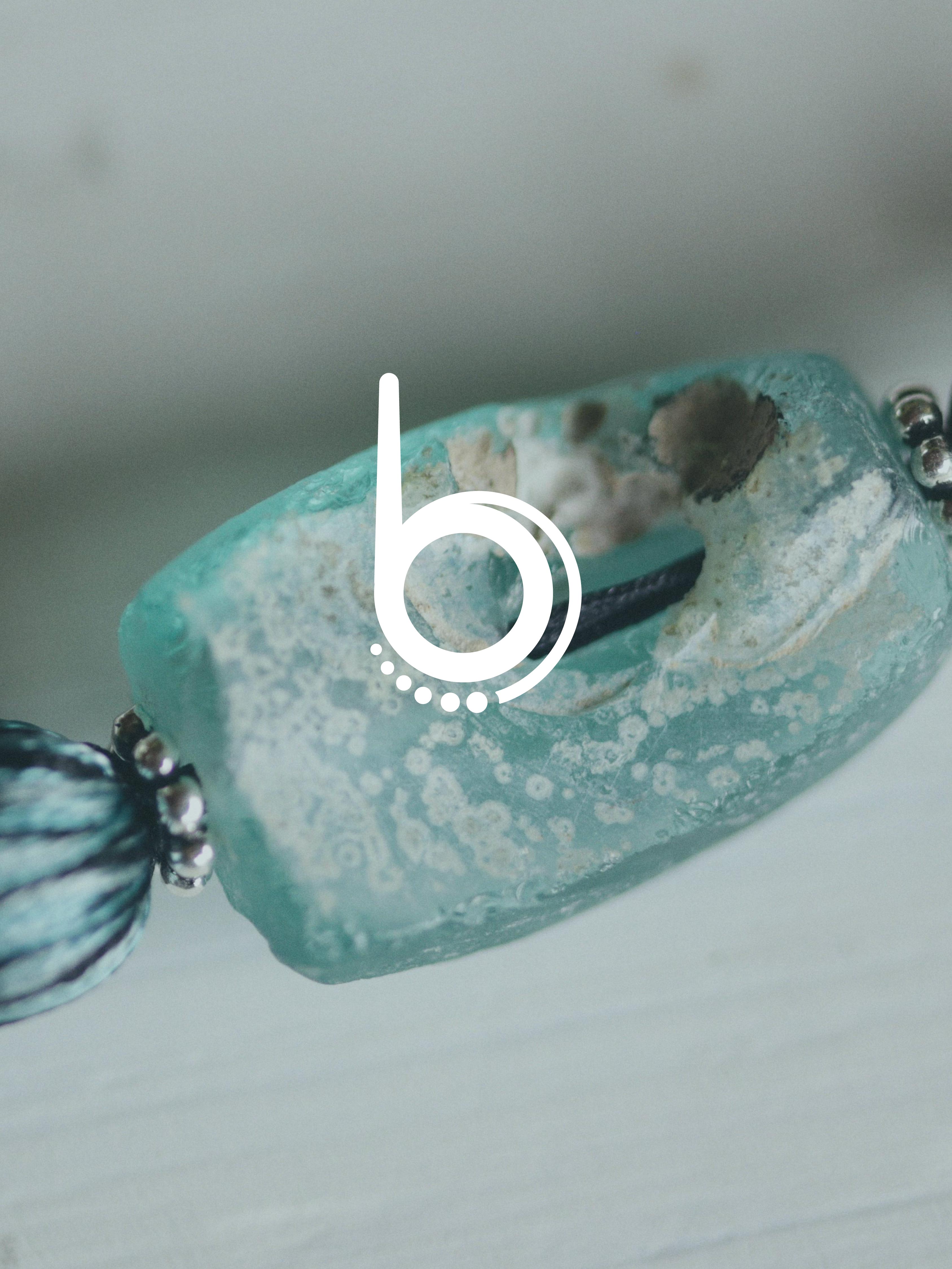 Batch.Works logo over a photo of a box of 3D printed objects