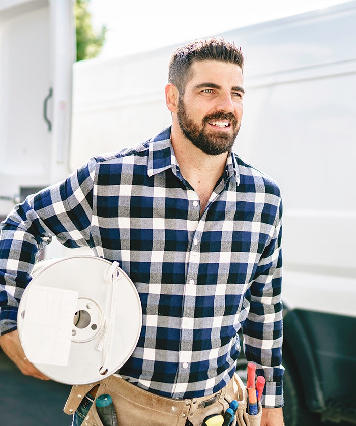 Low-Voltage installer walking to job site