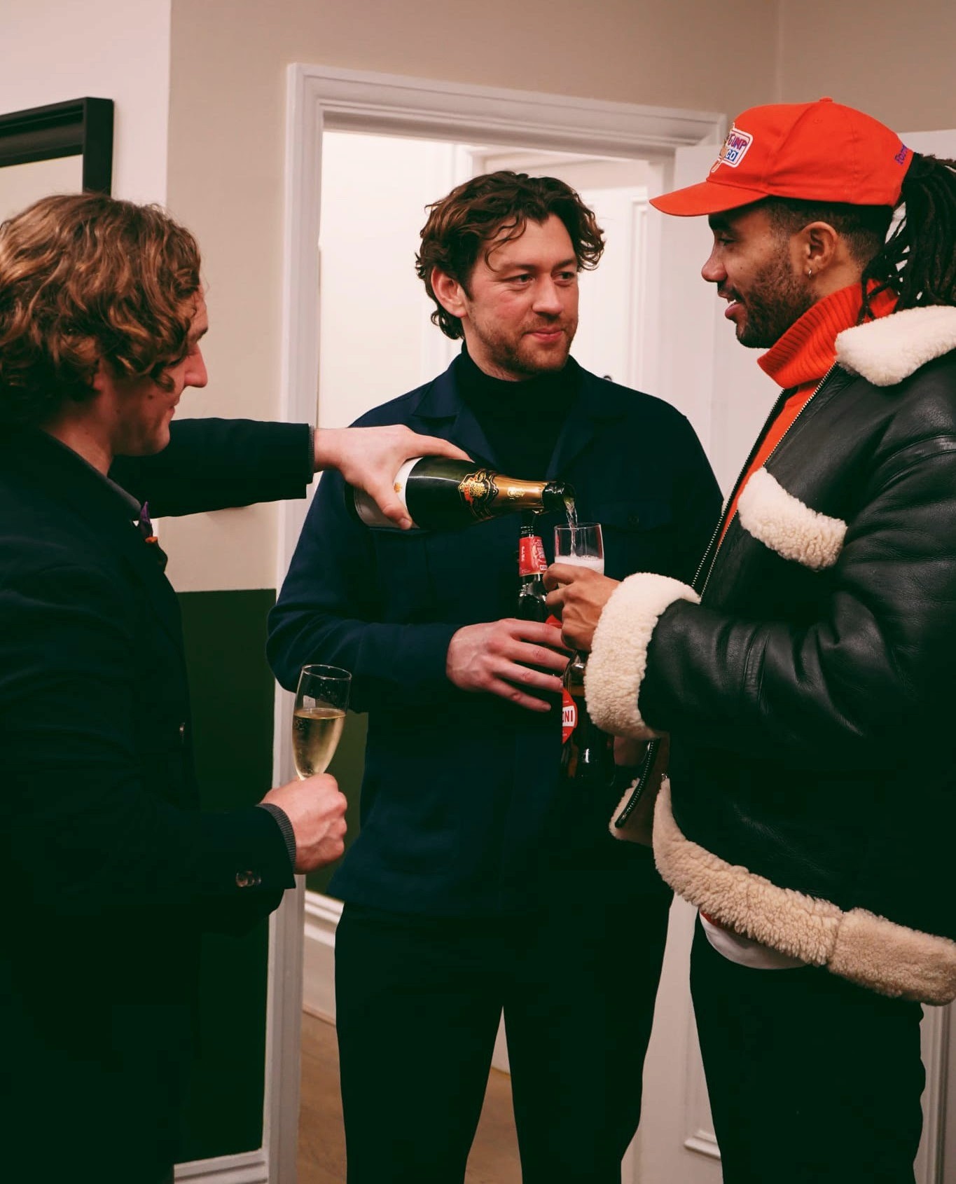photo of three stylish men enjoying drinks