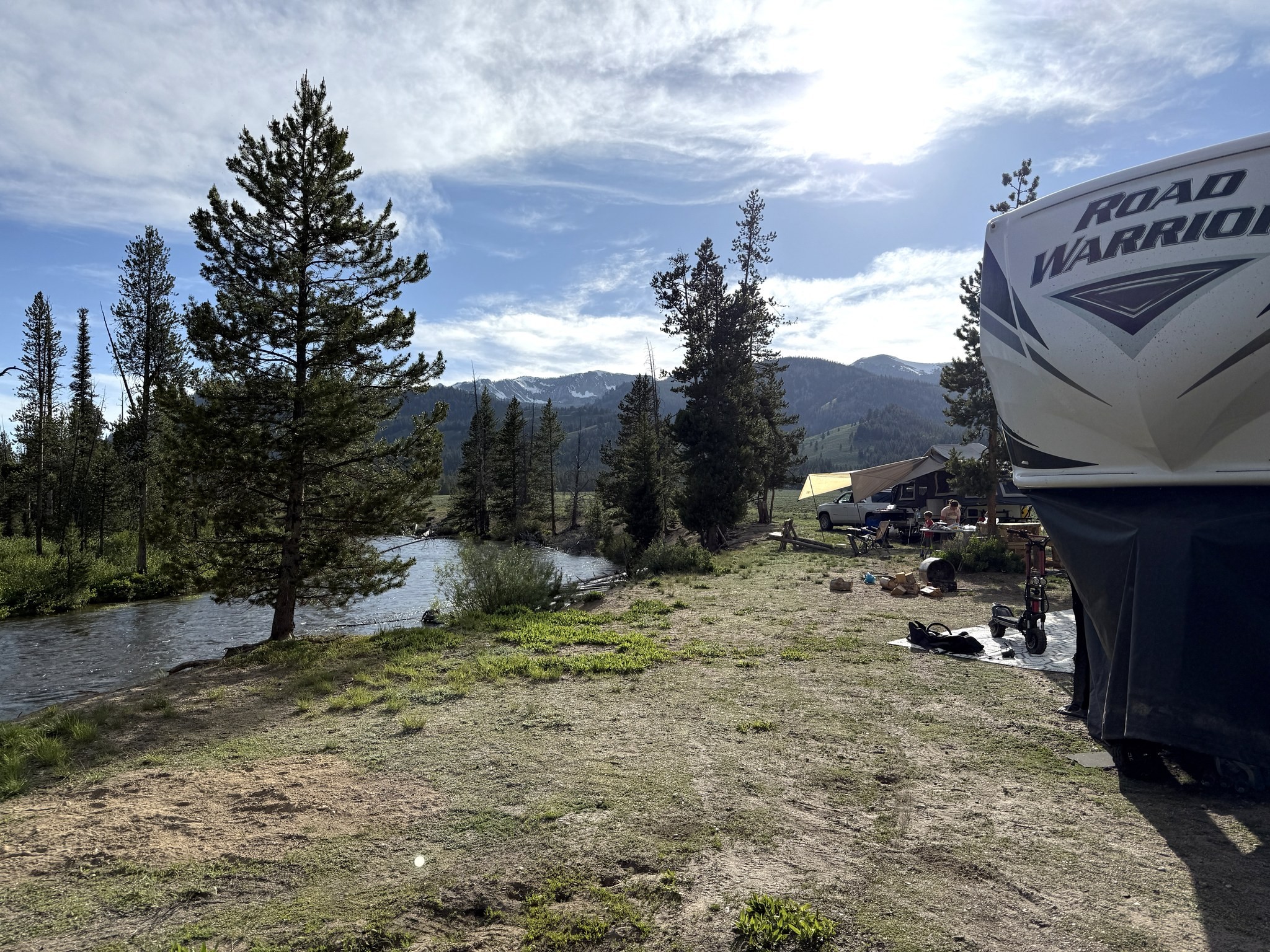 Boondocked campsite along Cabin Creek Road with the RV parked beside the creek