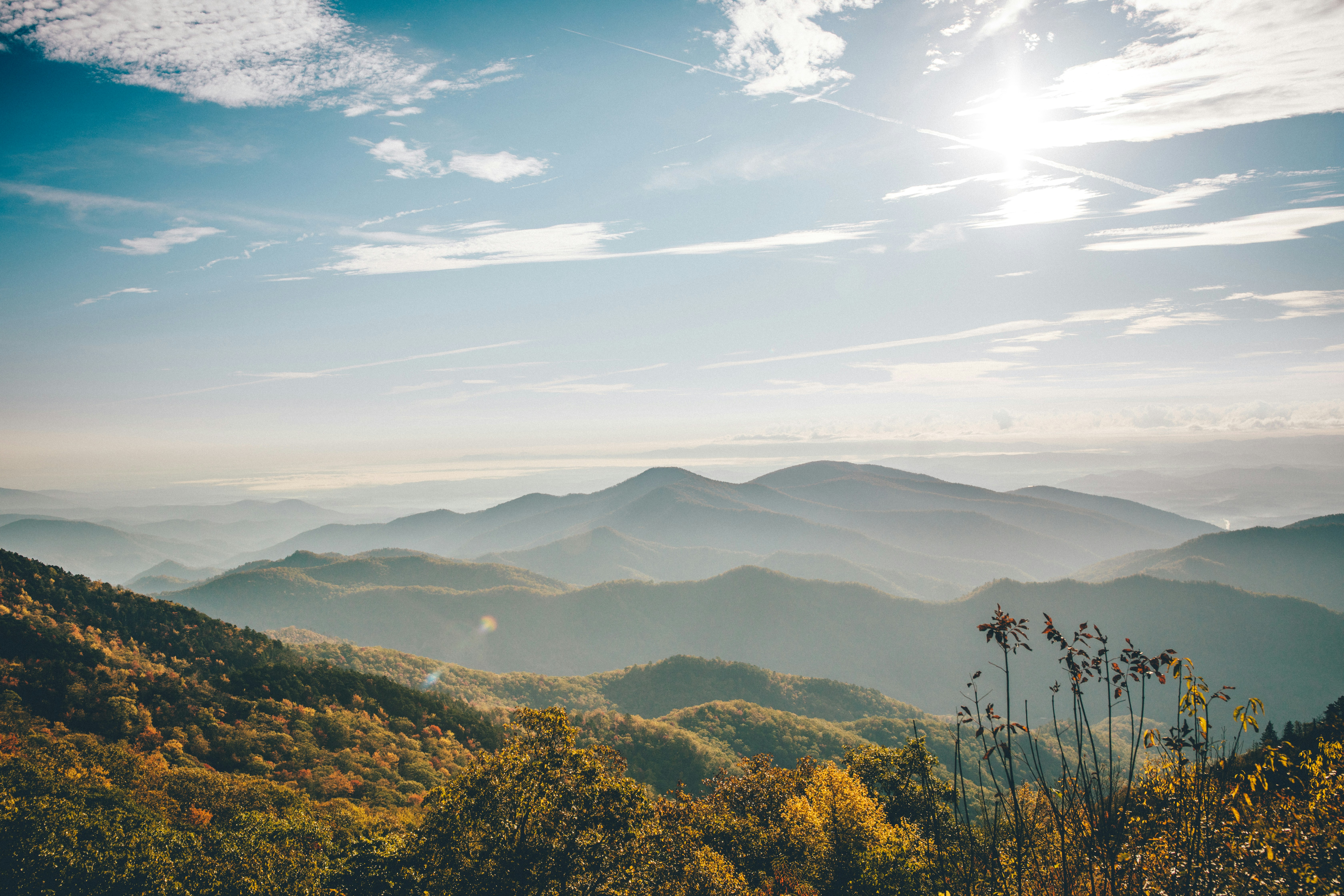 aerial photography of mountain under blue and white sky