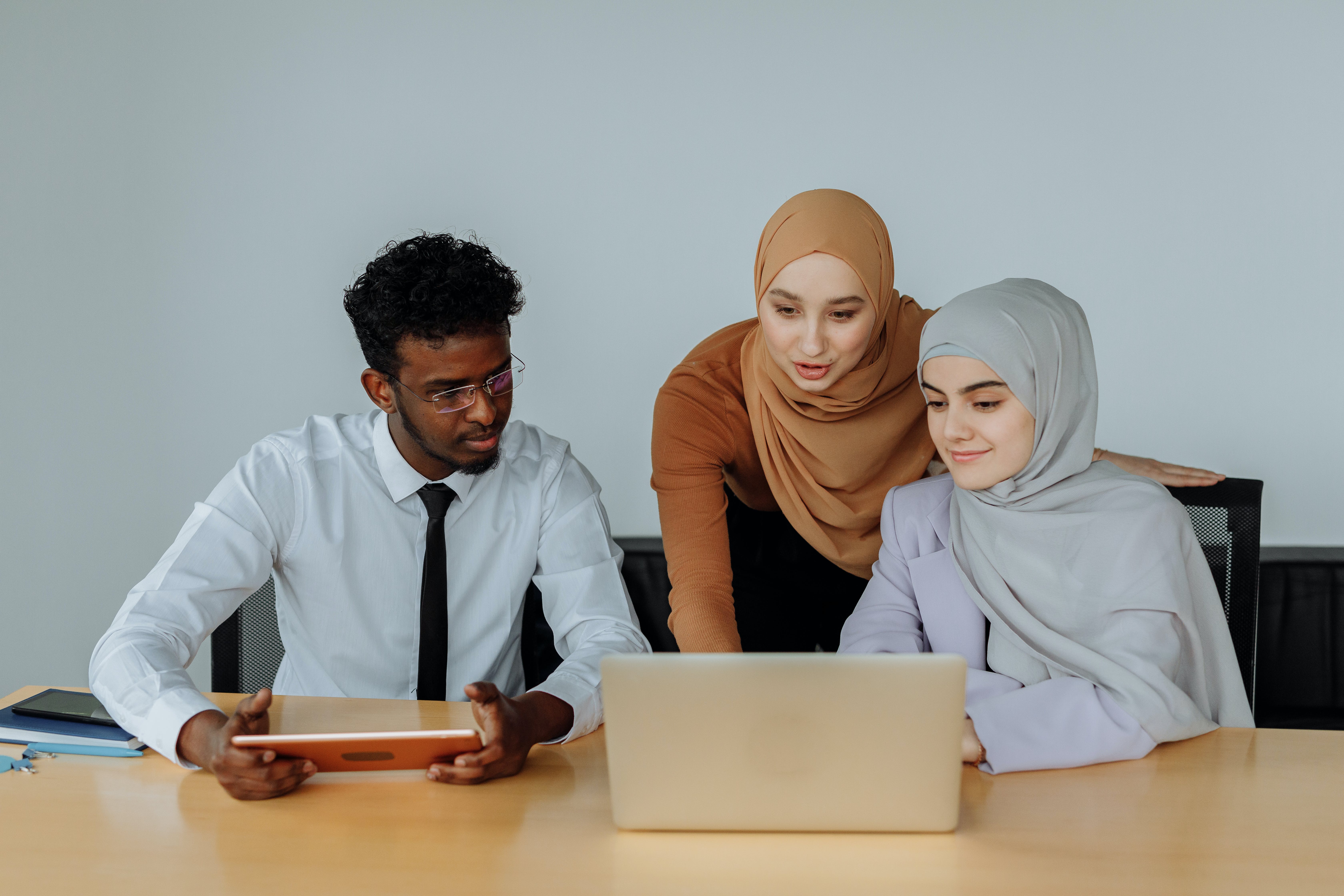 Woman in front of laptop explaining why it's cold "cold email"