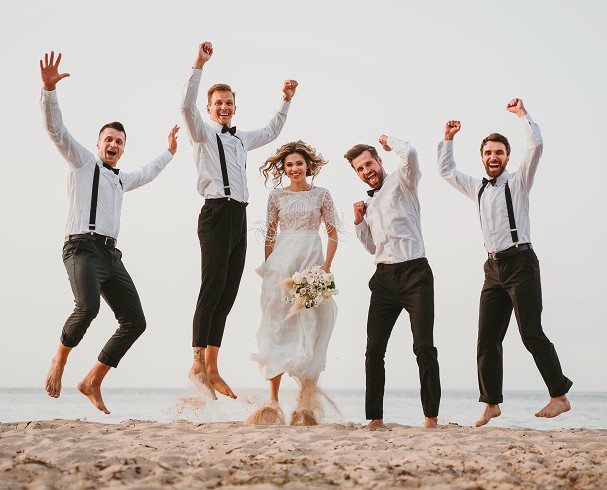 A stylish woman wearing a white hoodie and black glasses