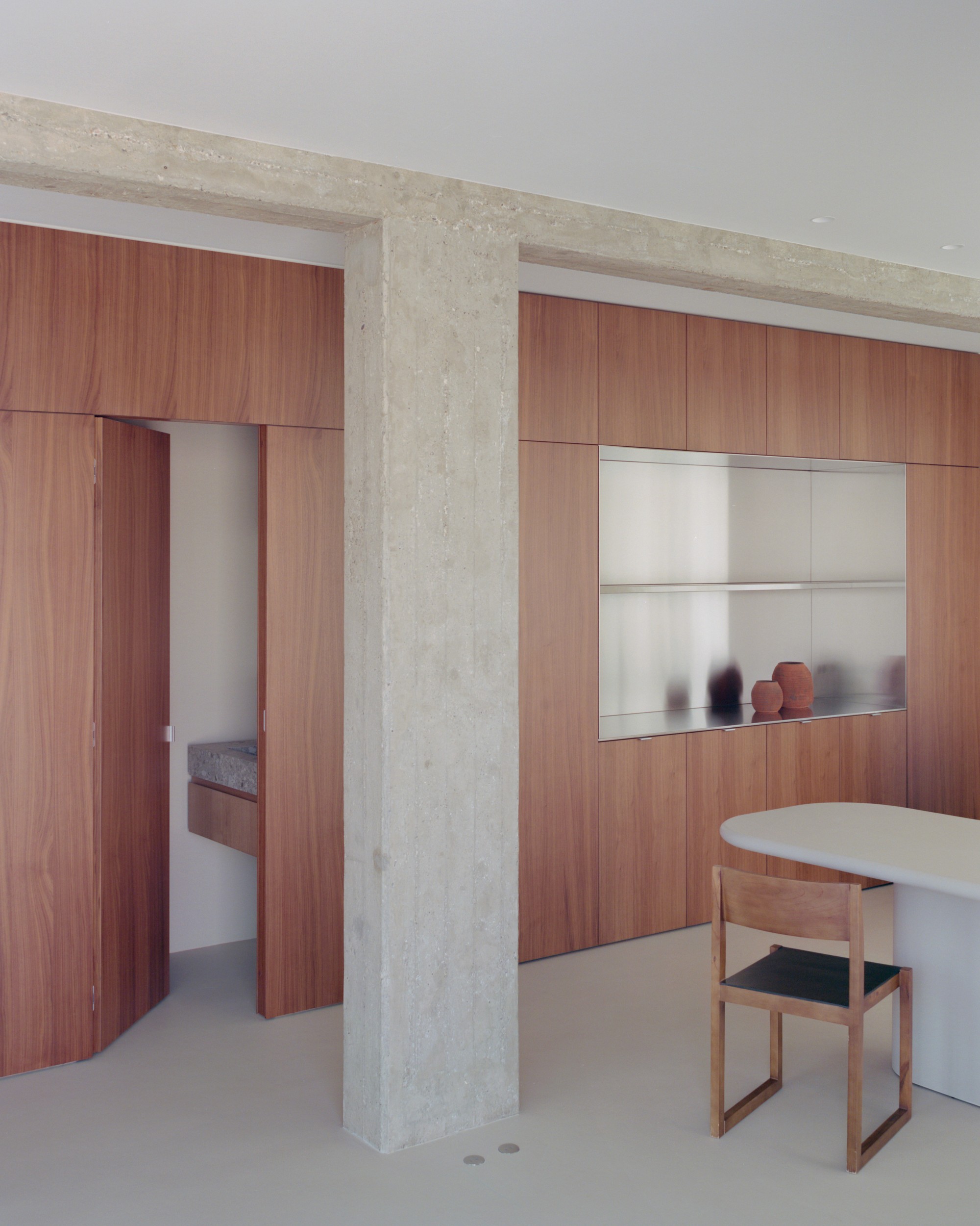Minimal kitchen island with suspended linear light