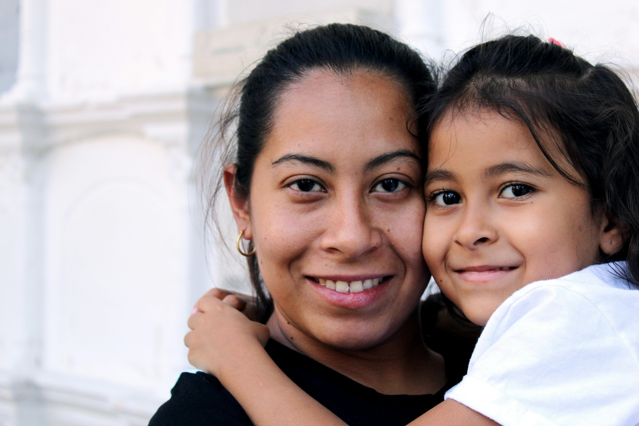 A parent and child hugging