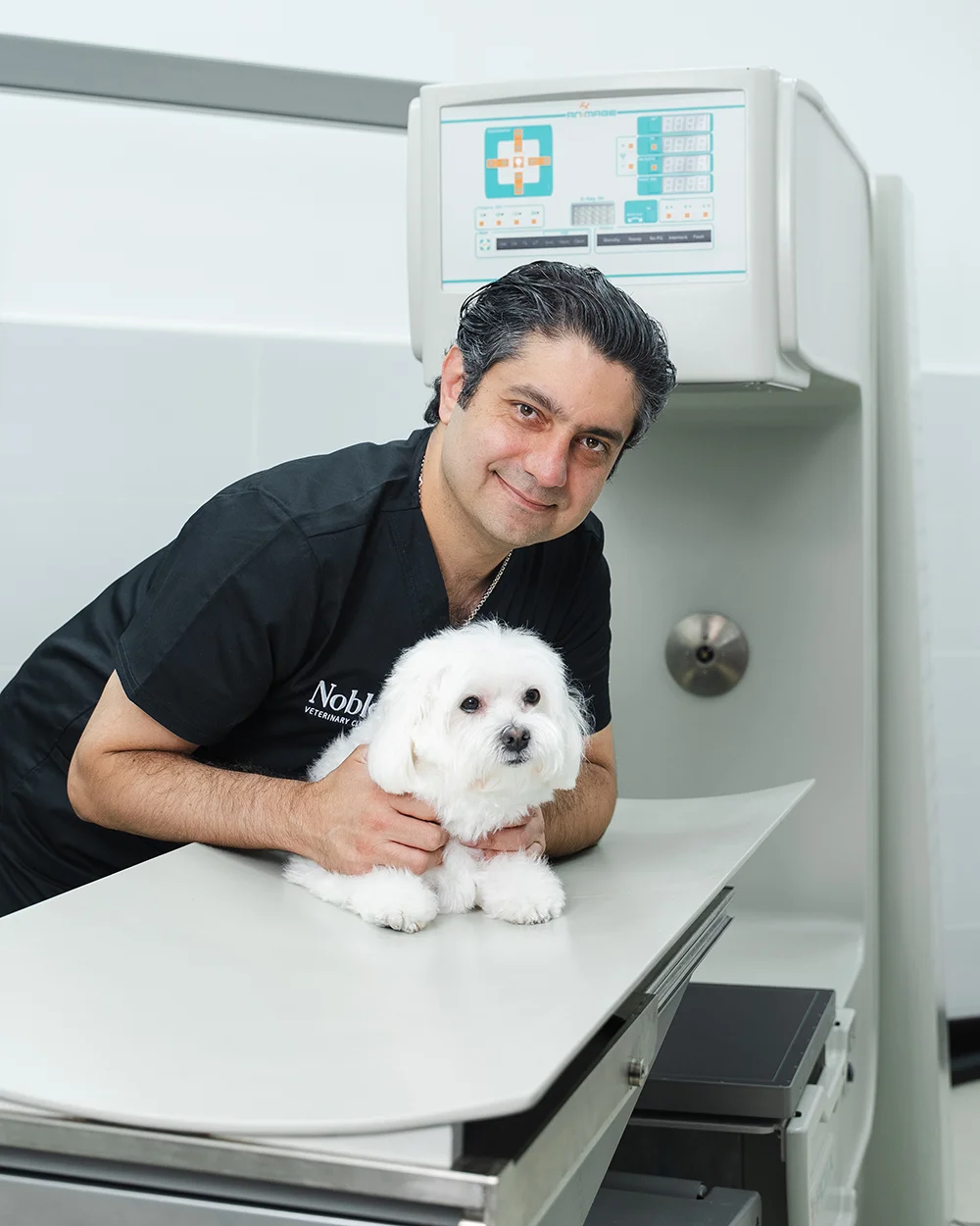 Dr. Soheyl Simaei examines Fidex CT imaging results during a diagnostic review.
