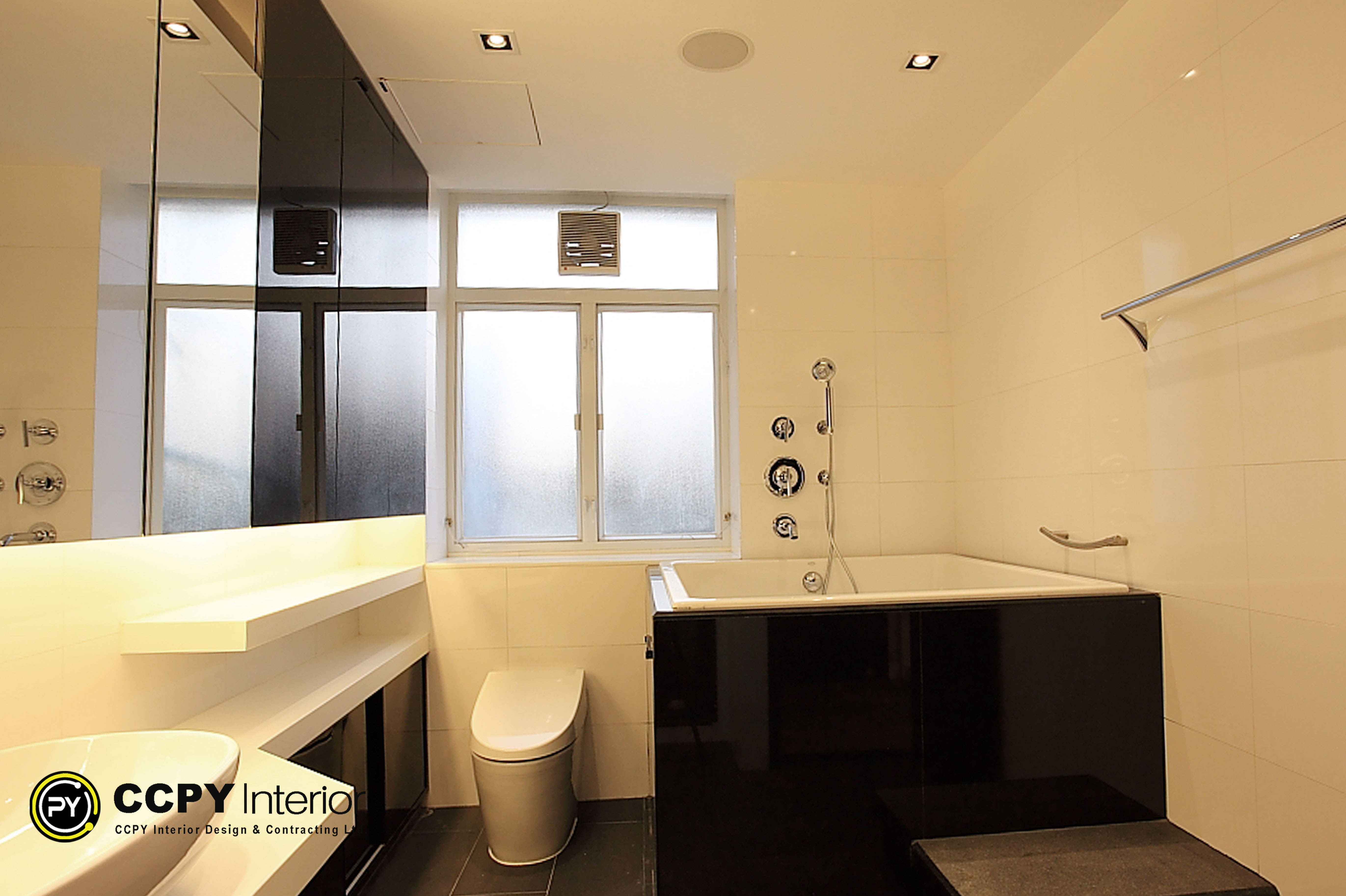 Full bathroom design layout featuring a wall-hung toilet, black soaking tub, and minimalist high-gloss storage at Standalone House, Perkins Road.