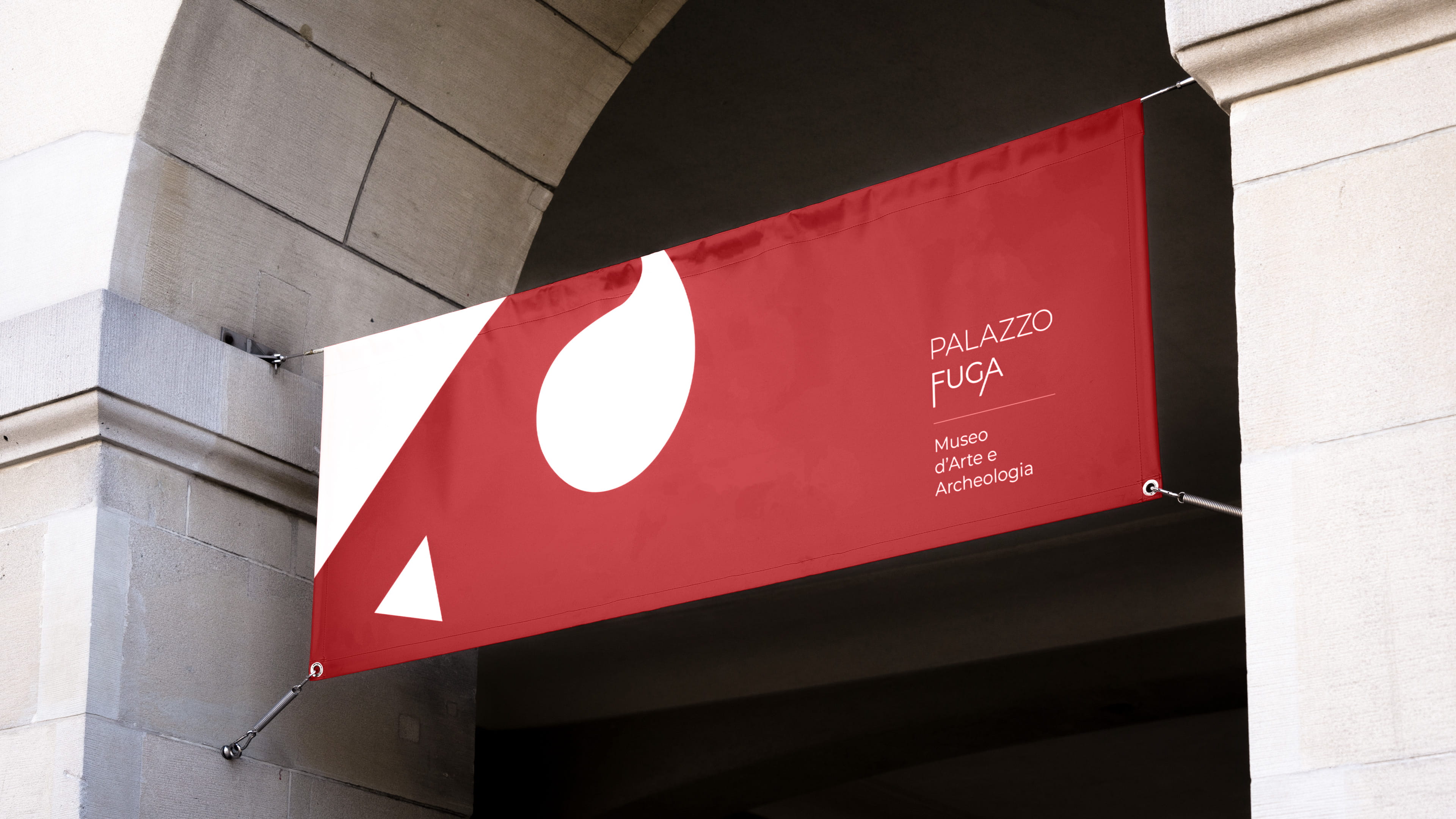 Red horizontal banner with Palazzo Fuga logo on stone arch