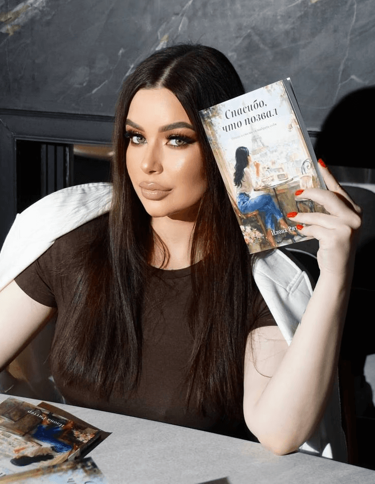 A couple embraces lovingly on a wooden dock.