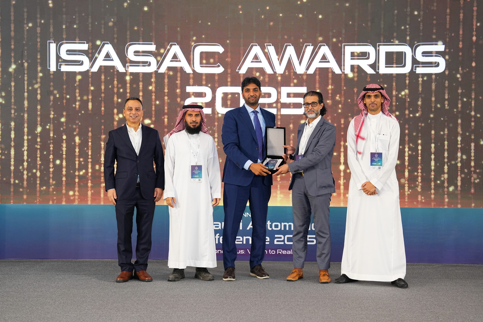 Group Taking a Selfie at a Concert Venue