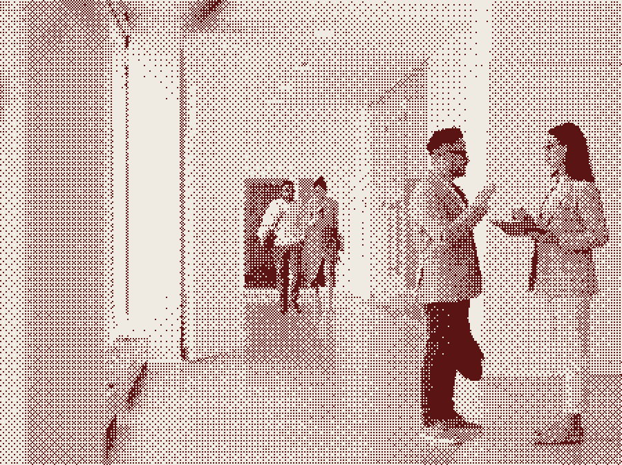 Two colleagues talking in a corridor