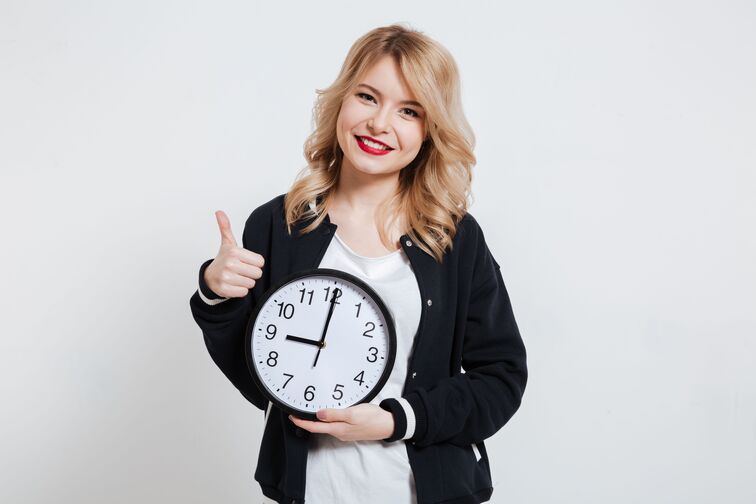 woman holding a clock