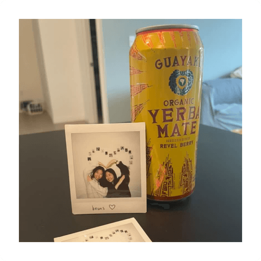 Photo of Revel Berry Yerba Mate and a poloroid of Vivian and her friend.