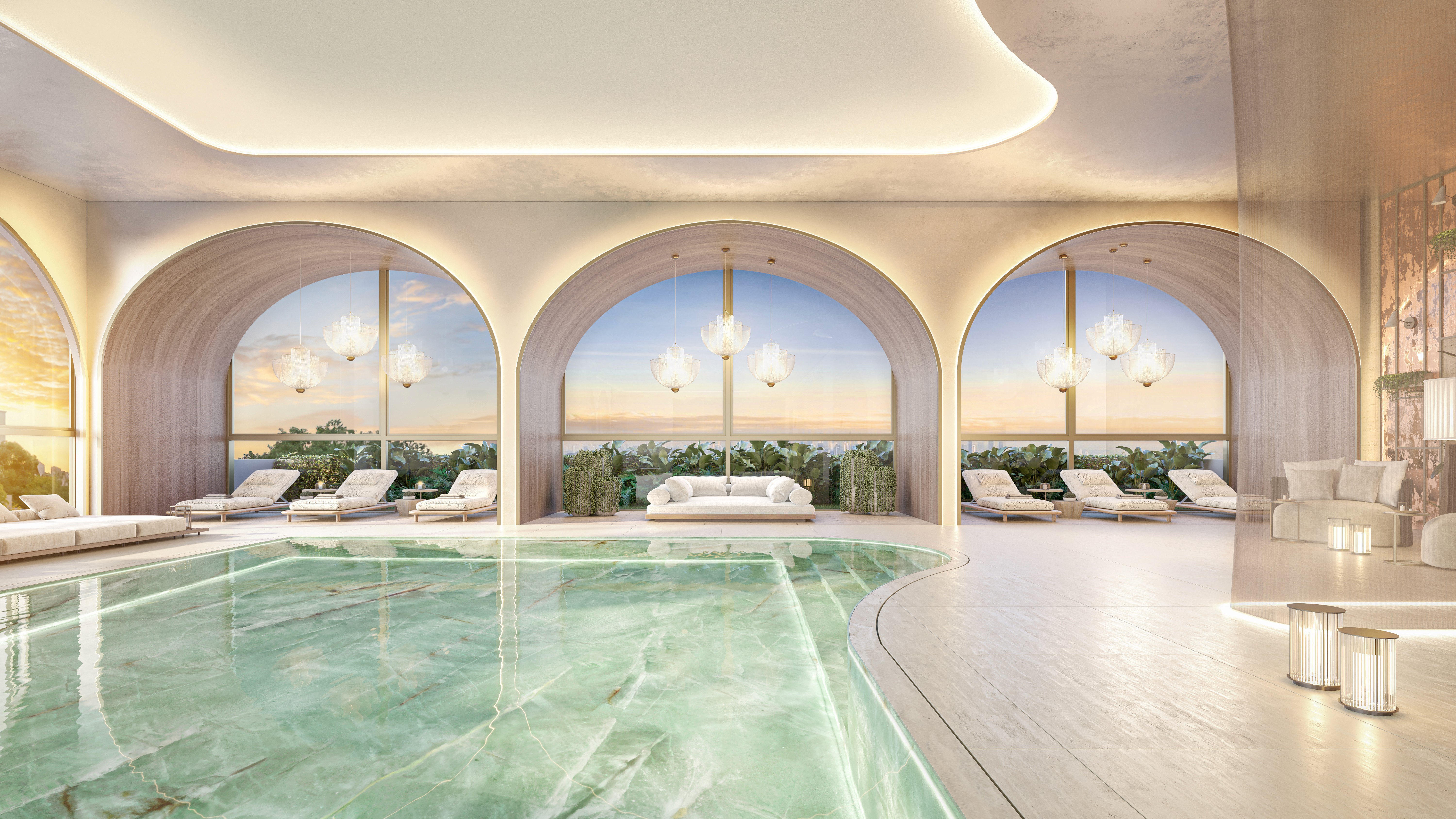 Curved modern skyscraper against a clear blue sky.