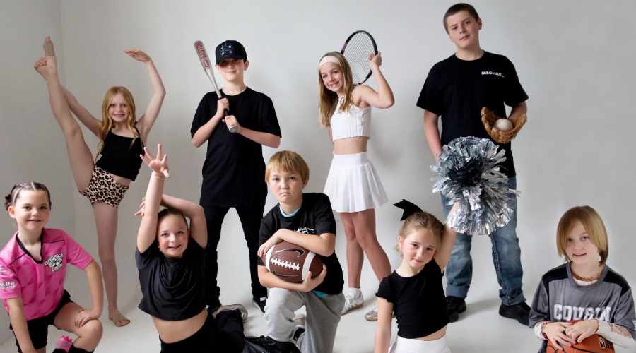 A group of youth display their various sports and athletic interests for the Monthly Move Project