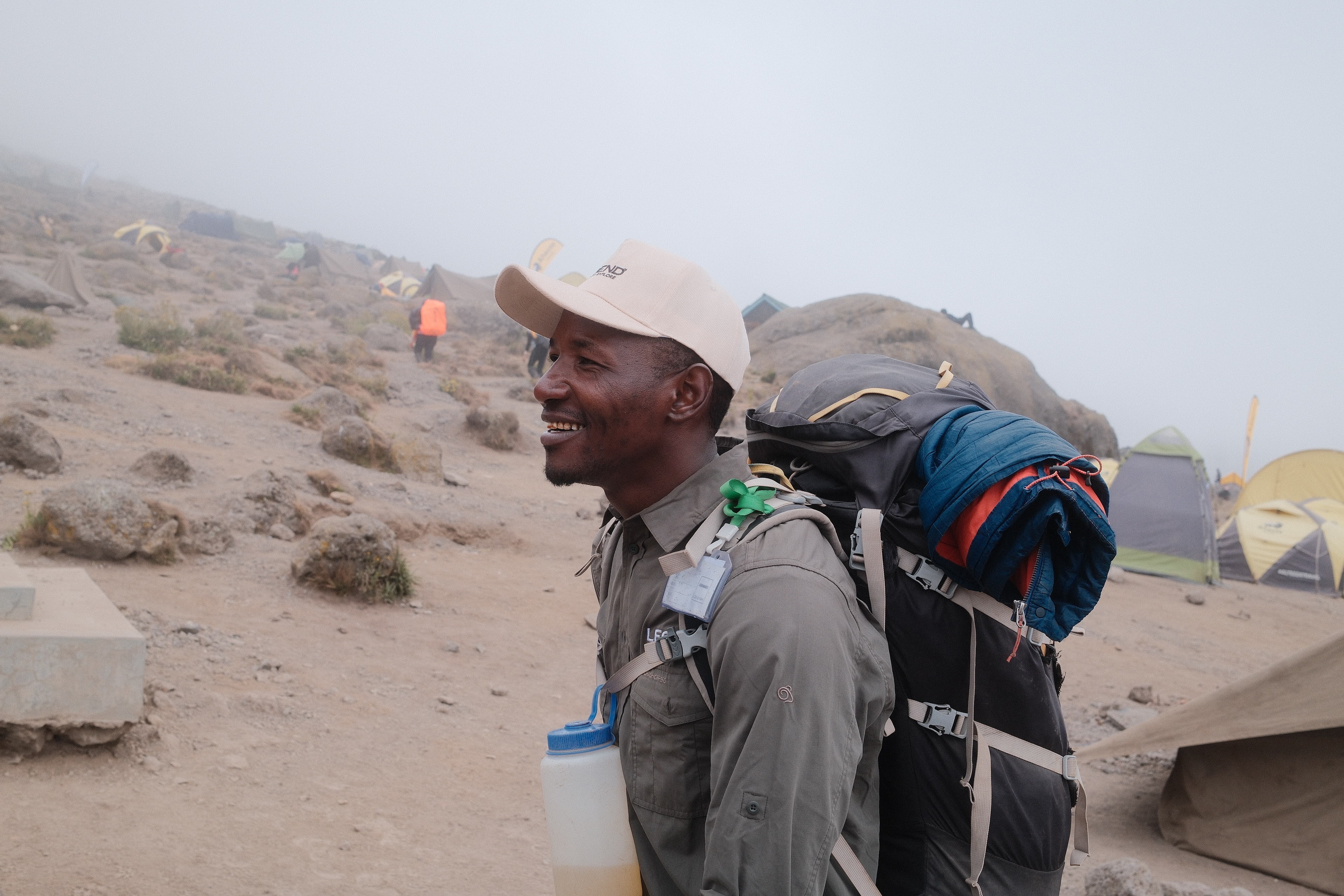Legend Expeditions WFR-trained guide checking a climber on Kilimanjaro