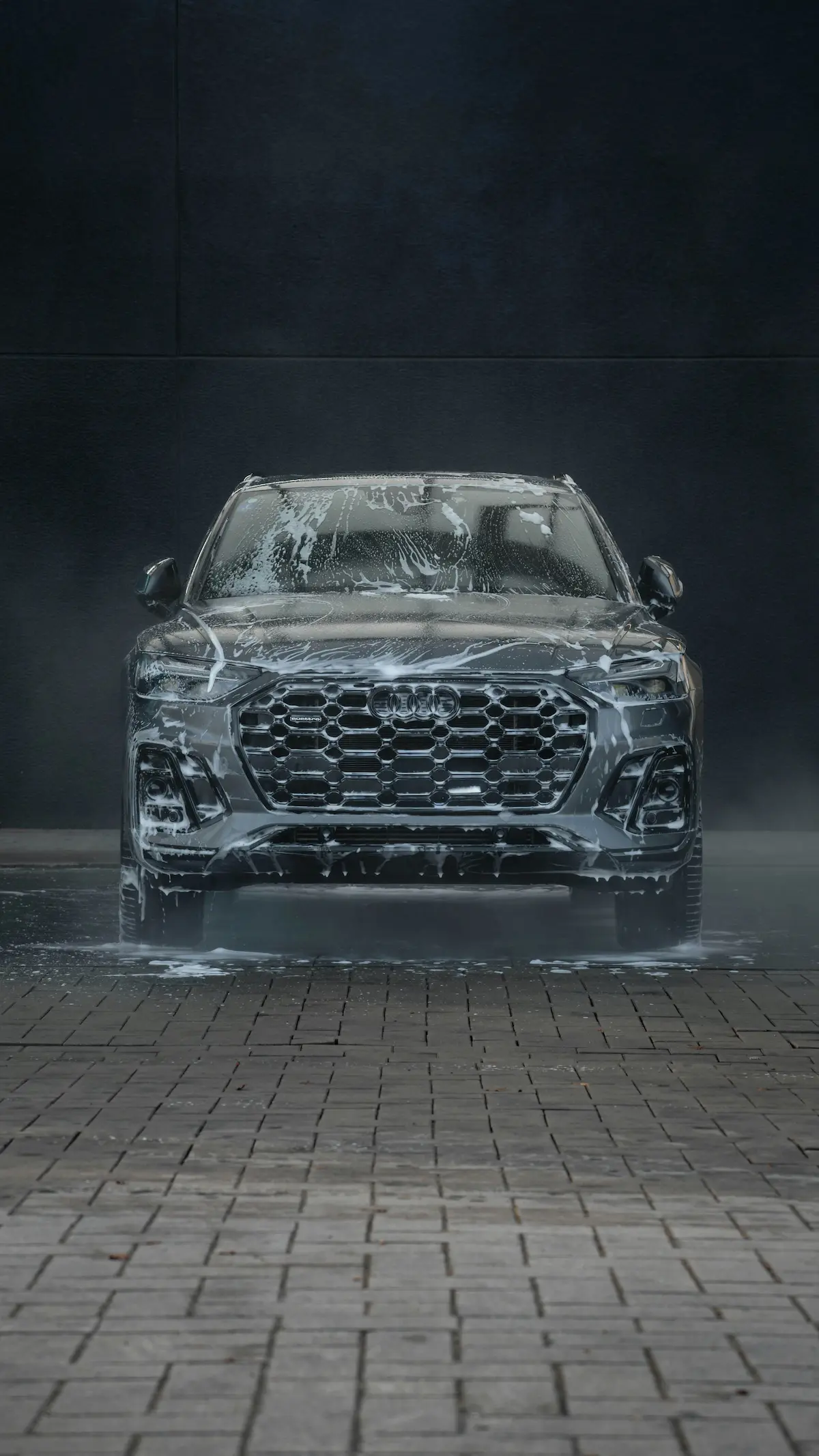 image of a car with soap suds falling off