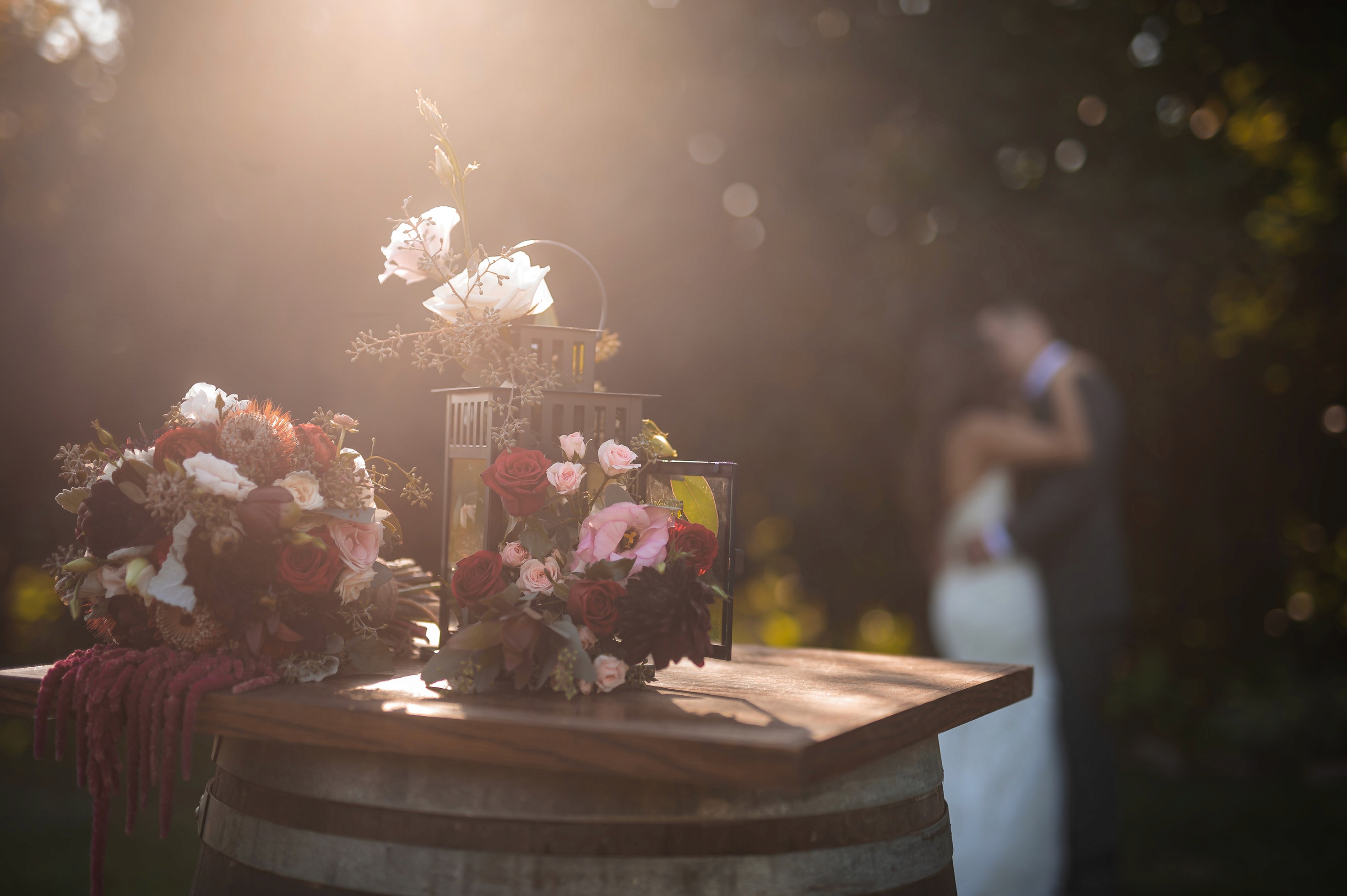 Flat lay wedding details with bouquet, rings, and sparkling bridal heels