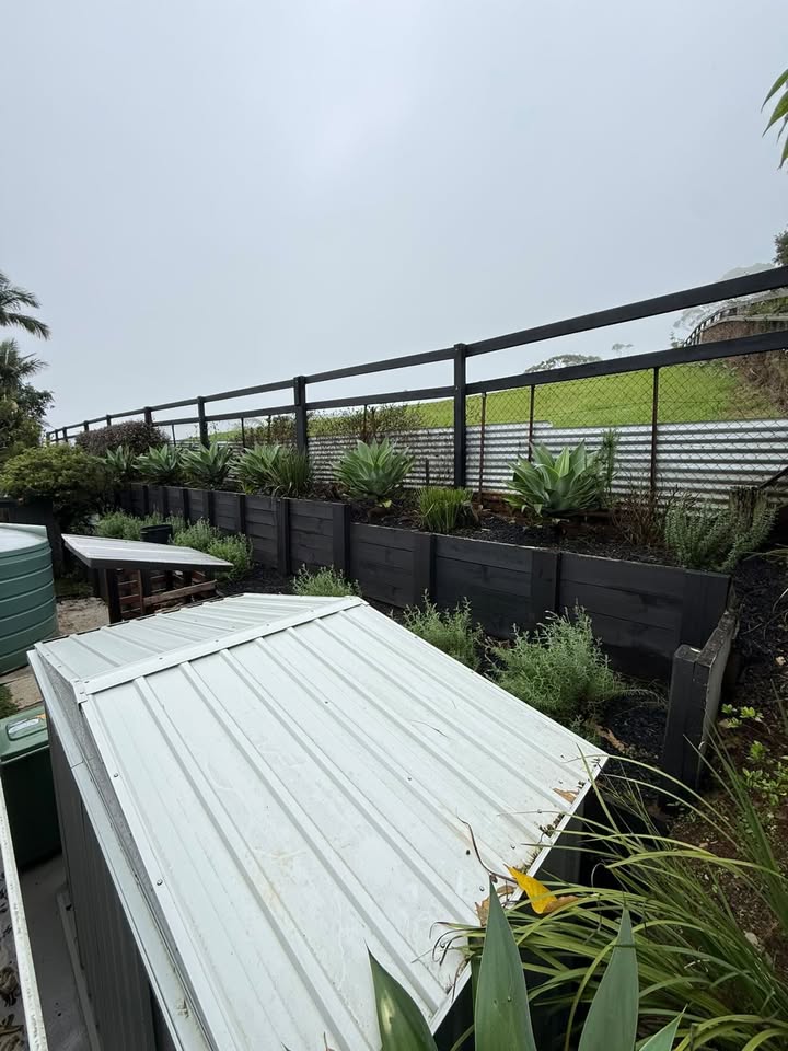Hepburn Property Maintenance team mowing and whipper snipping residential lawn Gold Coast