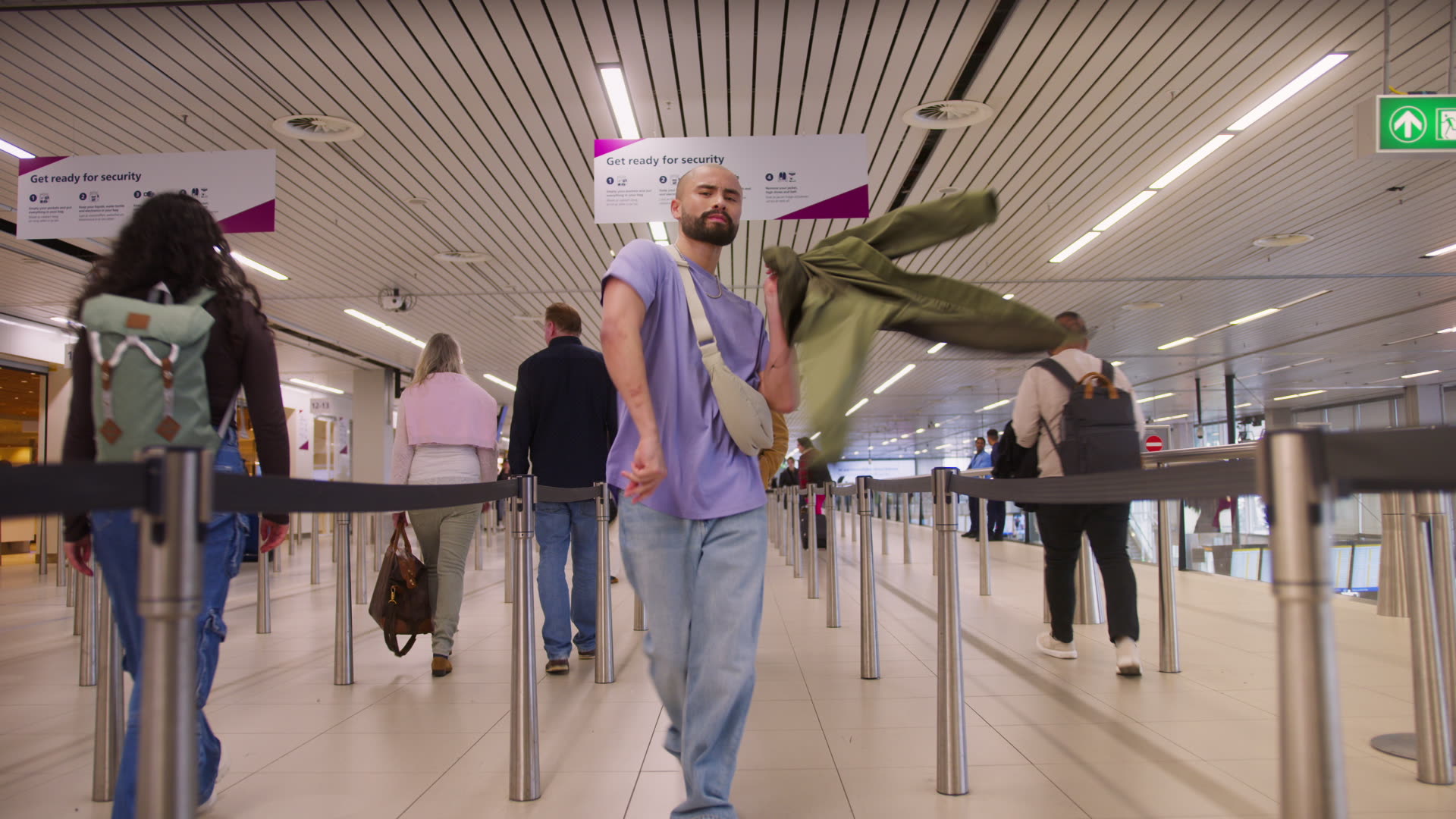 The image presents a serene and modern indoor setting, showing four individuals engrossed in using desktop computers.