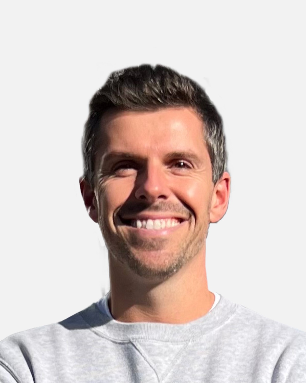 the portrait photo of a young and good-looking man, looking directly to the camera, smiling to the viewer