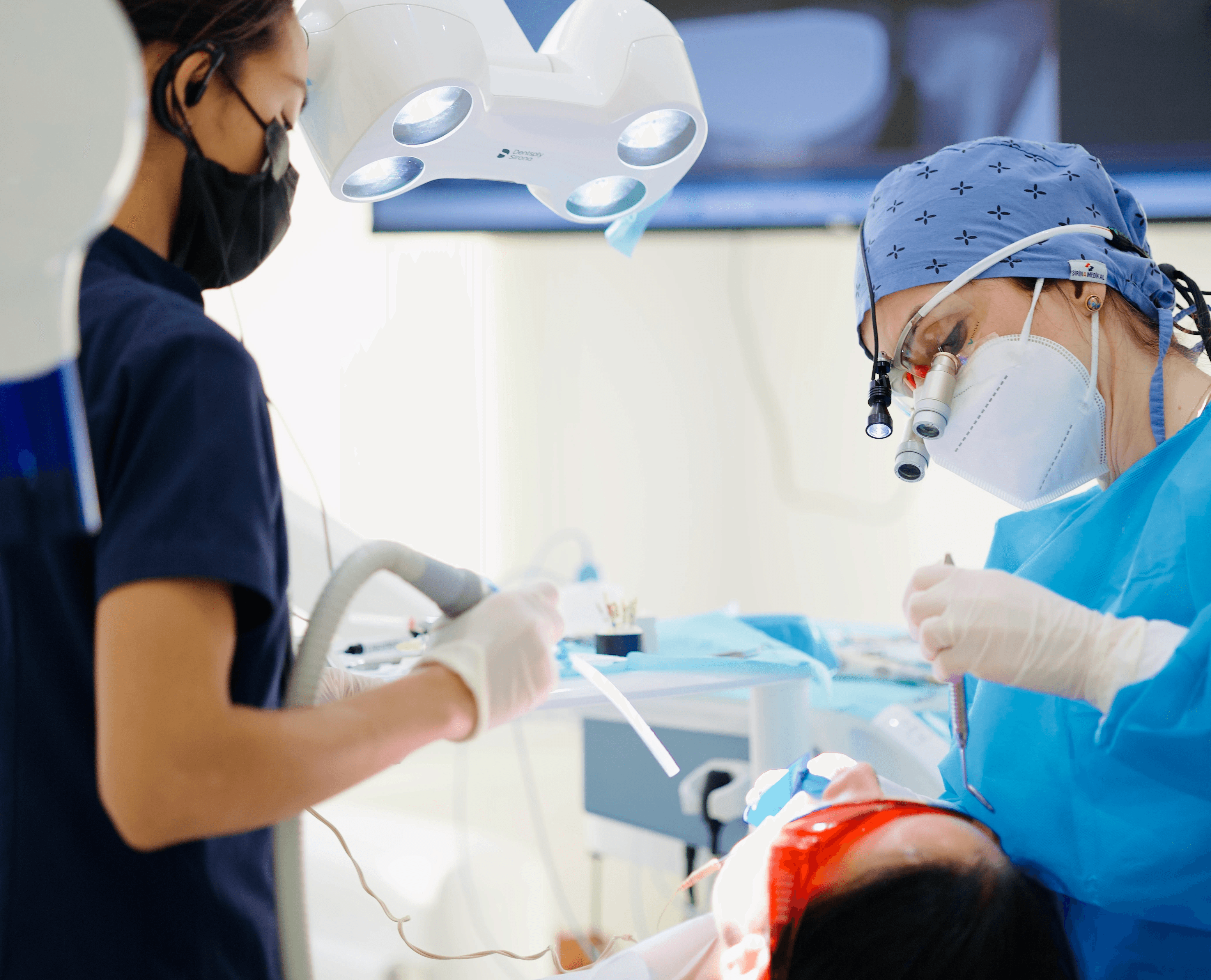 Dentist performing root canal treatment to address severe sensitive teeth symptom
